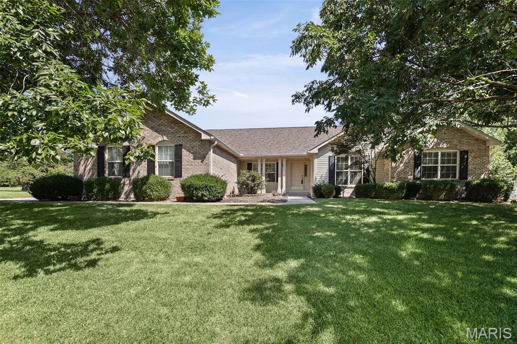 Welcome to 2036 Cedarwood Trail in the highly sought after Manors of Woodfield known for expansive homesites with mature trees and established character. This Lovely home with outstandng features is ready for you to make it your dream! Offering a spacious open floor plan, new flooring, vaulted ceilings, large kitchen w/ island and breakfast room, formal dinning, dedicated office space, open central great-room with cozy fireplace, partially finished basement, inviting back porch,  oversized garage and huge beautiful yard. Additional features and updates include: New roof 2025, new water heater 2025, new sump pump 2026. You will Love this ideal location with easy access to I-64, shopping, restaurants, parks, bike trail, local recreation, area entertainment, two new hospitals and Scott AFB.