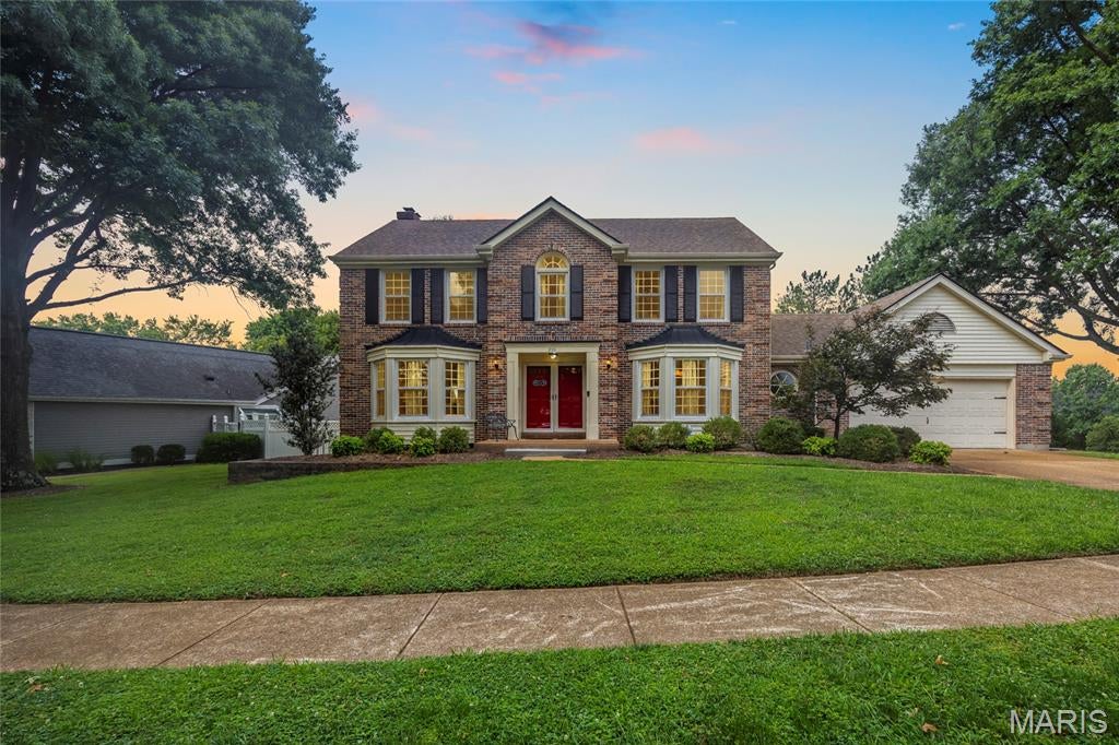 Welcome to 255 Timber Meadow Drive, a beautifully prepared 4-bedroom, 2.5-bath two-story in Wildwood’s desirable Timber Ridge Estates. Offering over 3,300 square feet of living space, a partially finished lower level, neighborhood pool access, a fenced .29-acre lot, and a rare 4-car tandem garage, this home delivers the space, updates, and flexibility buyers want in the Rockwood School District.

Inside, a classic center-hall floor plan opens to a bright entry foyer, hardwood flooring, and spacious formal living and dining rooms, each enhanced by a front-facing bay window. The inviting family room features hardwood parquet flooring, a brick gas fireplace flanked by built-in bookcases, a rear bay window, wet bar area, and direct access to the screened porch.

The eat-in kitchen offers a vaulted ceiling with skylight, tile backsplash, stainless steel appliances, ample cabinetry, tile flooring, and an adjoining breakfast nook overlooking the rear patio and large fenced backyard. A convenient main-floor laundry room is positioned just off the kitchen with direct access to the oversized tandem garage, creating a practical connection for daily living, storage, hobbies, or workshop use.

Upstairs, the vaulted primary suite includes a walk-in closet and private bath with double vanity, soaking tub, and separate shower. Three additional bedrooms and an updated hall bath complete the second floor, providing a functional layout for everyday needs, guests, work-from-home flexibility, or changing household demands.

The finished lower level adds valuable bonus space for a recreation room, media area, playroom, fitness zone, hobby setup, home office, or game-day retreat. A portion of the basement includes new LVP flooring, giving this area a clean, refreshed feel while still allowing room for storage.

Recent improvements include fresh paint, new carpet, remodeled bathrooms in 2025, replacement windows completed in 2018/2019, A/C replaced in 2017, fence installed in 2017, and new gutters, soffits, fascia, basement flooring, and porch screens in 2026.

The garage is a major differentiator, offering exceptional capacity for vehicles, bikes, tools, lawn equipment, outdoor gear, car enthusiasts, extra storage, or a dedicated workshop. That type of utility is difficult to find in this price range and adds everyday value well beyond a standard two-car setup.

Conveniently located near parks, trails, shopping, dining, and daily services, this move-in ready Wildwood home combines usable square footage, thoughtful updates, outdoor enjoyment, subdivision amenities, and a highly sought-after West St. Louis County setting. Feeds to Ellisville Elementary, Crestview Middle, and Lafayette High.