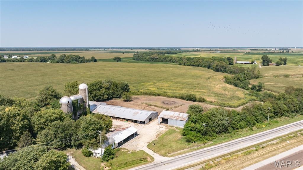 Don't miss out on this opportunity to use your imagination and operate your business in a high traffic, high visibility area right along I-55, only about 1/4 mile off an exit ramp!!  This 5 acre +/- property is just off the intersection of IL Rt.4 and I-55 outside of Worden, and includes multiple structures and opportunities to attract visitors off of I-55 or traveling Old Rt 66.  Property zoned commercial.