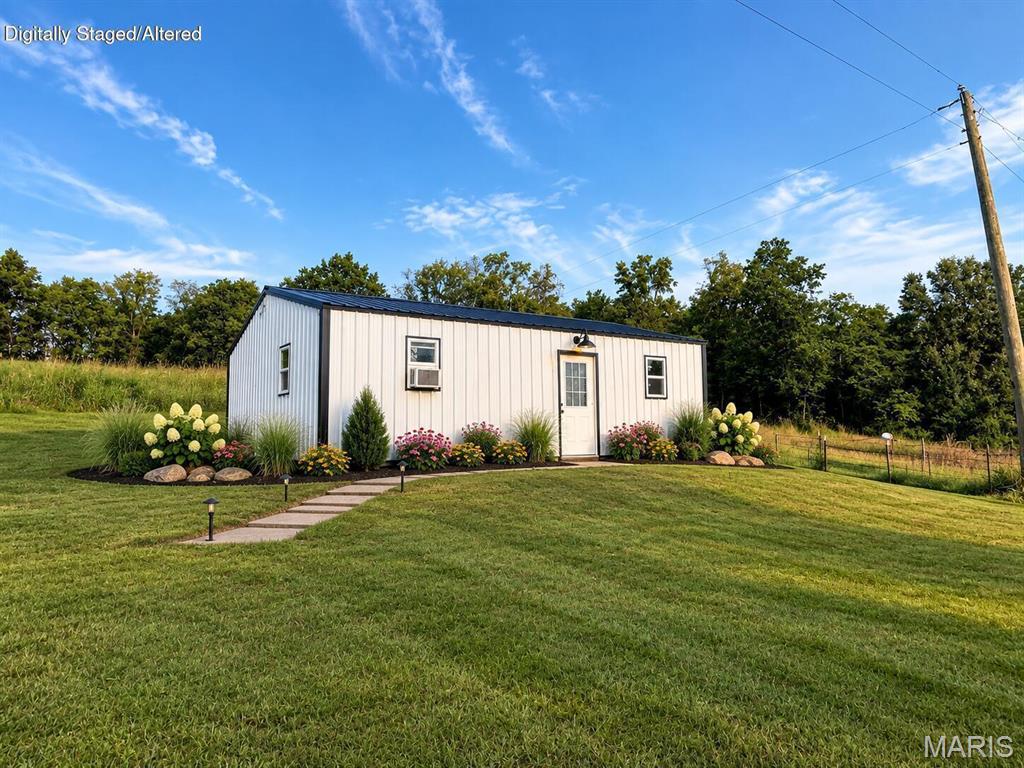 Check out this DEAL! Homestead-Hunting Cabin- Small home to Live in while you build your Forever Home. SO MANY OPTIONS! Located on 5.84 Surveyed Acres in the country is where you will find this homestead with NO RESTRICTIONS and LOW TAXES - ONLY $142 IN 2025!!!! There is a mix of open and wooded land with property fenced for a few head of livestock. There is also a fenced area for your dogs, chickens or garden as an added bonus!!!!! In front of the home is a pond to enjoy living the life in the Ozarks with peaceful views! Inside this maintenance free-efficient home there are 3 non-conforming bedrooms (no closets), a full bathroom, laundry area and open kitchen-dining-living area. Abundant wildlife is everywhere you look. The opportunities are ENDLESS! Less than an hour from Bull Shoals Lake. Call to day to view this one of a kind property!