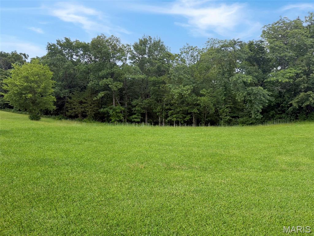 Discover the perfect setting for your custom dream home on this beautiful 1-acre lot nestled within an upscale community. Surrounded by natural beauty and backing to mature trees, this homesite is ideally positioned at the end of a quiet cul-de-sac for added privacy and tranquility. 

Nestled in one of the area's premier neighborhoods, this rare homesite offers the perfect blend of luxury living and natural beauty. and is just minutes from Washington, Missouri.

Backing to mature trees, you'll enjoy privacy, peaceful views, and a picturesque setting that's increasingly difficult to find. With ample space for your dream home, outdoor living areas, pool, detached shop, or additional landscaping, the possibilities are endless.

Cobblestone Creek is known for its upscale homes, spacious lots, and convenient location, offering easy access to Washington's shopping, dining, schools, healthcare, and recreational amenities while maintaining a quiet, country-like atmosphere.

Whether you're ready to build now or secure a premium homesite for the future, this is a unique opportunity to own one of the most desirable parcels in a high-end community where luxury homes and natural surroundings come together. 

 Community features include public water and sewer, underground utilities, concrete streets with curbs and gutters, high-speed internet, and protective covenants. Residents also enjoy access to a scenic 4+ acre stocked lake. Conveniently located near the country club, shopping, restaurants, and the Washington riverfront, this is one of the final opportunities to build in a premier luxury neighborhood.
