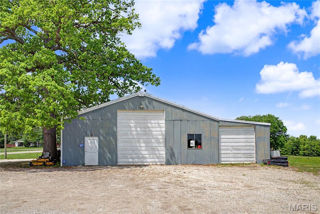 This is a rare opportunity to acquire a fully equipped, high-functioning shop property just outside of Jackson along the highly trafficked Missouri Route 72. Situated on approximately 1 acre, this 5,262 SF building is purpose-built for automotive or industrial use and offers a highly efficient layout designed for workflow and productivity.

The 120’ deep structure features drive-through capability with 14’ overhead doors at both ends, allowing for seamless access and movement of vehicles or equipment. Inside, the property is outfitted with valuable specialty infrastructure including a paint booth, in-floor frame rack, and an alignment rack—making it a turnkey solution for automotive repair, body shop operations, or similar users.

With strong visibility, easy access, and a layout that supports high-volume operations, this property is ideal for an owner-user or investor looking for a functional, hard-to-find shop space in the Jackson market.