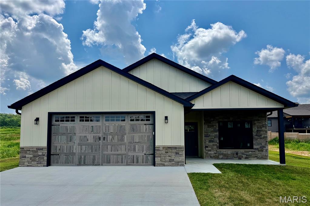 Welcome home to luxury, maintenance-free living in Potosi! This stunning new construction custom villa offers 1,760 sq. ft. of fully accessible, main-level space featuring absolute zero-step entry throughout the entire property and handicap-accessible interior doors. Best of all, the HOA handles all lawn care and snow removal!
This 2-bedroom, 2-bathroom home centers around a massive open-concept floor plan designed for effortless movement and entertaining. The heart of the home is the custom kitchen, beautifully appointed with premium quartz countertops. The kitchen flows seamlessly into the light-filled living area, highlighted by soaring vaulted ceilings and a cozy fireplace. Retreat to the expansive master suite, complete with a generous walk-in closet. Enjoy the outdoors year-round with both a covered front porch and a spacious covered back patio. Includes an oversized garage with dedicated extra storage space. Located in Brookside Villas, this home perfectly blends high-end finishes with universal accessibility.