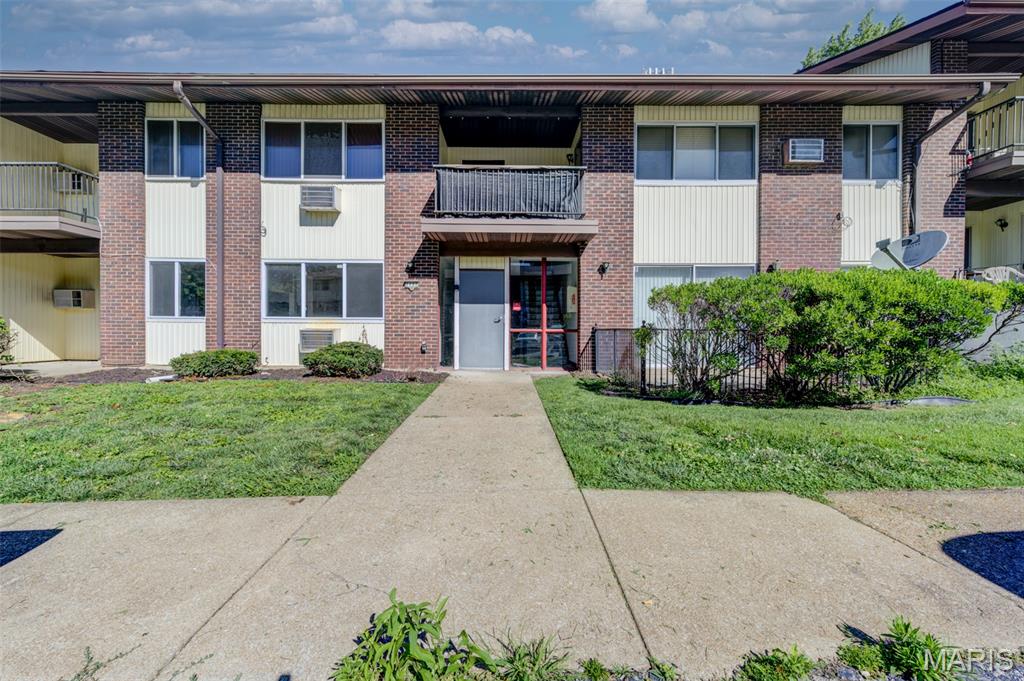 Move-in ready and beautifully renovated, this main-level 1-bedroom garden unit offers abundant natural light and easy, stair-free access. Recent updates include fresh paint throughout—walls, ceilings, doors, trim, baseboards, and cabinets—along with updated lighting, ceiling fans, A/C units, and appliances. The low-maintenance brick exterior with vinyl siding, enclosed soffits, energy-efficient thermal windows, and a 2022 roof provides peace of mind. Inside, enjoy luxury vinyl plank flooring, handsome upgraded bath vanity, faux stone countertops, a double stainless-steel sink, and a functional, open layout. The private covered patio, accessible from both the kitchen and bedroom, offers a secluded outdoor retreat. Refrigerator and home warranty are included. Residents enjoy expansive green space, attractive common areas, and a spacious lobby with convenient mailbox access. Community amenities and a prime location near major roads, highways, shopping, dining, and everyday conveniences add to the appeal. Rentals are allowed, making this an excellent opportunity for both homeowners and investors. Exceptional value, low-maintenance living, all electric living, reserved parking space and a convenient location make this home a must-see!