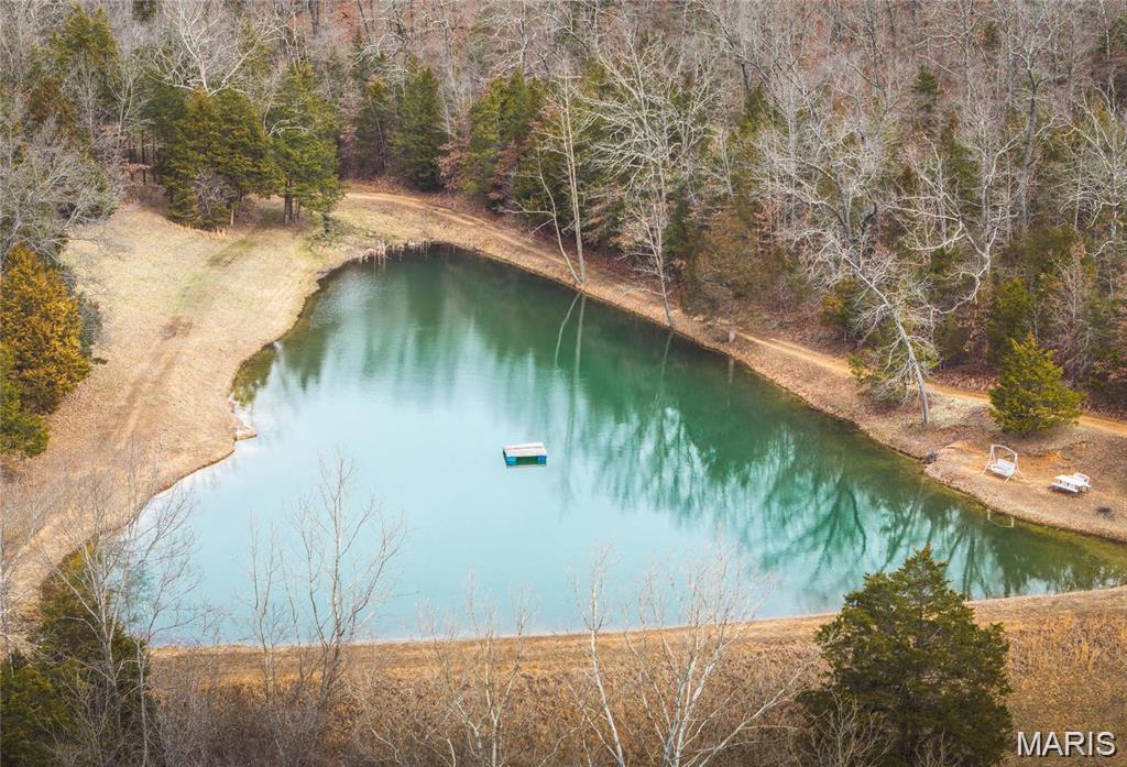 36.73 ACRES (+/-) AND Spring Fed Lake!  Build your dream home on the lake with ALL the views! Great LOCATION: Only 4 miles to Rolla city limits, Close to Rolla employers, University campus and amenities.  It is centrally located between St Louis, Columbia and Springfield. This place has so many possibilities!  The acreage has woods for hunting, approx 8 acres cleared for hay or pasture, a big spring fed lake & 2 other springs on the property.  The views are gorgeous and the land is well groomed and has a private park like setting.  This is your private place in the country w/ everything you could ask for!  The DEER and WILDLIFE LOVE it and so will YOU!