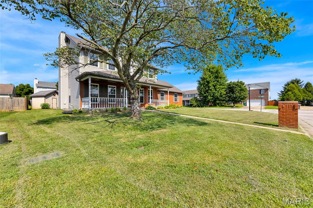 Welcome home to this beautifully updated two story home offering the perfect blend of space, comfort, and style! Situated on a desirable corner lot, this property features inviting covered front and back porches, generous backyard with a patio and storage shed, and an ideal location just minutes from local amenities. Inside, you'll love the spacious layout featuring a welcoming living room with a cozy brick wood-burning fireplace that flows seamlessly into the kitchen. The kitchen offers a breakfast bar, abundant cabinetry, and all appliances stay. A formal dining room provides additional entertaining space, while the upstairs primary suite features vaulted ceilings, a luxurious bath with double vanity, soaking tub, separate shower, and generous closet space. The current owners have recently completed even more updates, including finishing two bedrooms and a full bathroom in the basement, significantly expanding the home's functional living space. Fresh paint and new flooring provides a clean, modern feel that's ready for its new owners to enjoy. Passed occupancy in-hand, let's make this home yours!