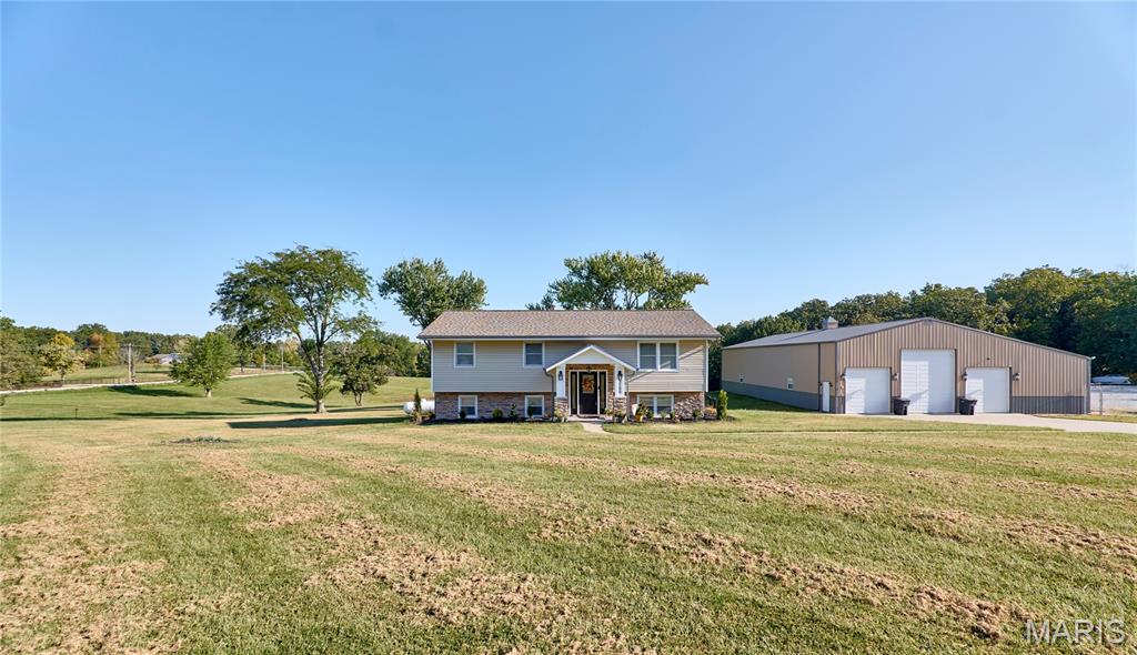 GREAT INVESTMENT OPPORTUNITY with 10 acres, shops, 1 acre pond, income producing Rv/Boat storage 1 miles from the St. Charles County line and 8 miles from Wentzville! SELLLERS SAY MAKE OFFER! Owner is open to splitting property with buildings, business and home with 3 acres for $550k! Seller's well maintained home is on the market at incredible value! Blacktop roads- no known restrictions and features boat, rv, trailer storage business included in the sale plus 40X80 shop with 16 ft lean to and 220 electric with concrete floors , oversized garage doors great for camper and so much more! There is also another 60X30 shop as well-the home is basically all remodeled with leathered granite counter tops throughout,  all kitchen appliances stay,several newer windows, rebuilt composite deck, 4 bdrms, 2 full baths, hot tub will stay. So many new items that are endless.  - the list goes on, we will have flyer attached to supplements in MLS with list of extras/more details-so much potential to to rent existing home and storage income to help fund new construction on the property(lots of wildlife)-call today. Call agent for full details; this property has endless possibilities