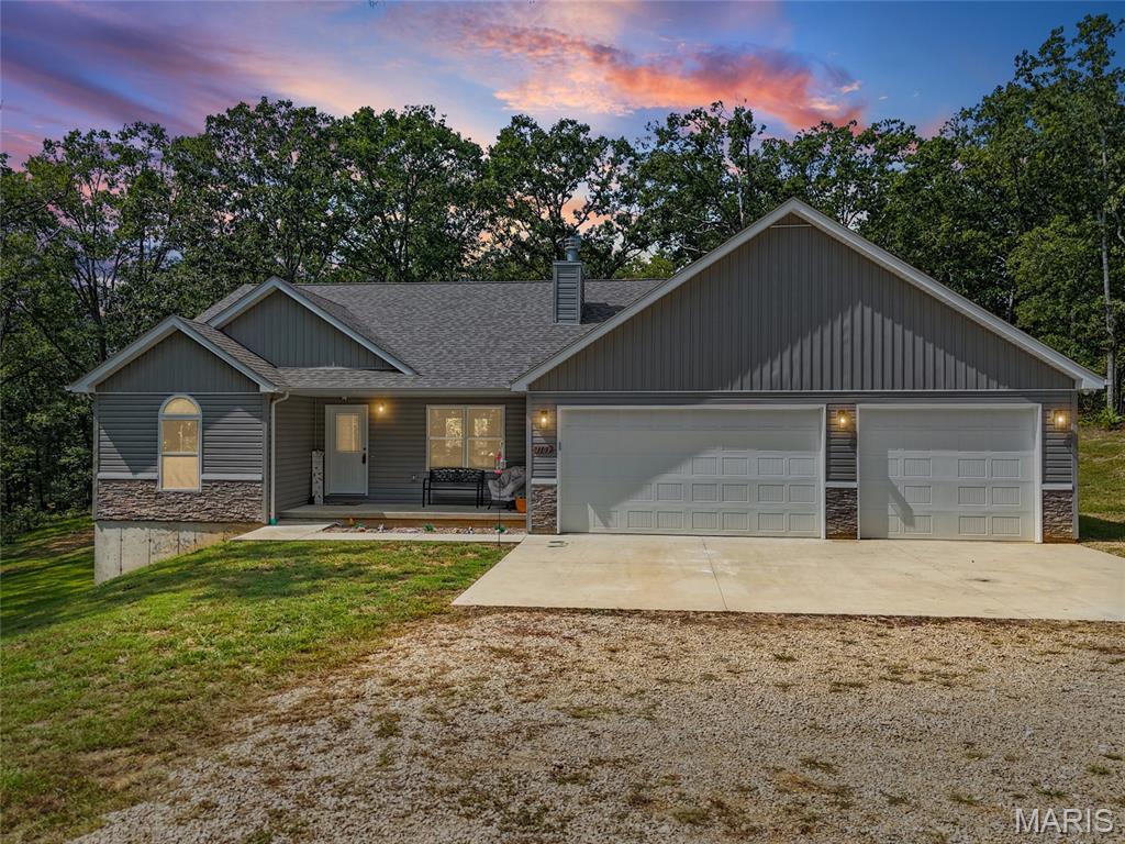 WOW! Secluded, peaceful, and surrounded by 3 acres, this 4-year-old ranch offers the privacy you’ve been looking for without sacrificing modern comfort! Step inside to an inviting open floor plan with plenty of natural light, creating an easy flow between the living, dining, and kitchen areas. The split-bedroom layout offers added privacy, with the primary suite separated from the additional bedrooms. Featuring 3 bedrooms, 2 full baths, and a 3-car garage, there’s plenty of space for both everyday living and storage. Step outside to enjoy the covered deck, perfect for morning coffee, relaxing evenings, or taking in the peaceful wooded surroundings. This home offers everything you've been looking for including room to spread out, enjoying nature, and creating your own private retreat. With being only 4-years old, you can enjoy the benefits of moving right in. This home is worth looking at! Address doesn't pull up on maps so it's easier to GPS 1102 Hickory Court and take the gravel driveway all the way down to the house.