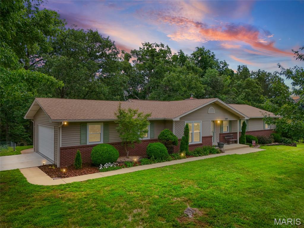 Welcome to your private piece of paradise! Nestled on 3.85 beautiful acres in the desirable Fox C-6 School District, this 3 bedroom, 2 full bathroom home offers the perfect blend of comfort, space, and opportunity. Step inside to find a warm and inviting dining room, a large living room with a stunning fireplace, and a spacious eat-in kitchen perfect for gatherings. The basement provides endless possibilities to finish and make it your own. Enjoy your mornings or evenings on the brand-new deck overlooking the peaceful park-like setting, featuring a large flat front yard with plenty of room to enjoy the outdoors. With a brand-new driveway and so much potential, this property is ready for its next owner to make it home. Do not miss out on this well-maintained property that has tons of upgrades!