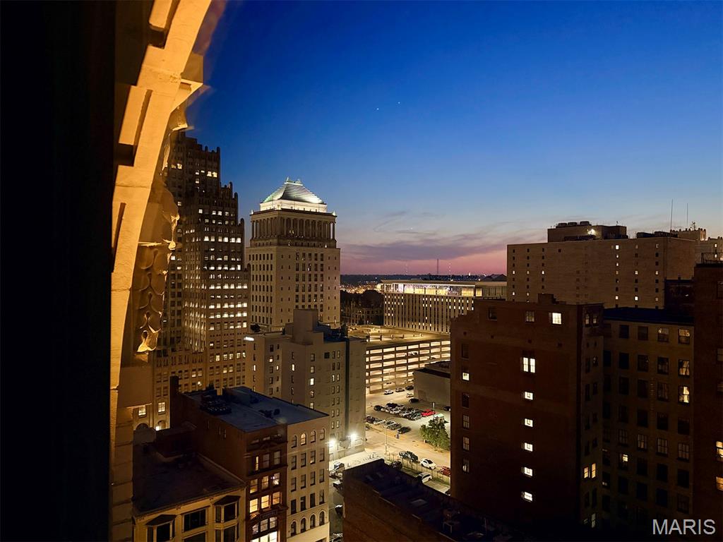 Premier luxury living in downtown’s premier location, The Syndicate puts an extraordinary collection of restaurants, entertainment, culture and everyday conveniences virtually at your doorstep. From the building, you can stroll to Citygarden, Kiener Plaza, Ballpark Village and the Gateway Arch, while the grocery store is conveniently accessible by elevator without ever having to step outside. Add to that one of downtown’s most impressive packages of resident amenities, and it is easy to understand why The Syndicate has long been regarded as one of the city’s premier addresses.

And condo 1404 is a perfect example of a premier residence within the building to complement its prestigious address. Located on the 14th floor—the building’s only floor featuring distinctive arched windows—this spacious one-bedroom residence combines sophisticated design, an efficient floor plan and an elevated western perspective that frames beautiful sunset views at the end of each day.

Inside, the residence offers a remarkably efficient floor plan where every square foot has a purpose. The living room flows naturally into the open kitchen, creating a comfortable space for both everyday living and entertaining, while two large windows fill the main living area with natural light and showcase the western views. A center island anchors the kitchen, complemented by beautifully rich, dark wood flooring that adds warmth and sophistication throughout the living spaces. Just off the kitchen, a dedicated space is perfectly suited for a dining table or, perhaps even better, a stylish home office. The private bedroom is generously sized and features an enormous walk-in closet, providing the storage that is so often missing from downtown one-bedroom residences. A convenient utility room just off the kitchen houses a high-end washer and dryer while also providing additional in-unit storage. The residence also includes private garage parking in the heated garage with EV capabilities, along with a private storage cage conveniently located in a climate-controlled room within the building.

And there may be no better time to be part of downtown. A new era of investment and activity is taking shape, with the highly anticipated Wash Ave Food Hall expected to open this fall, adding another destination for dining and entertainment just blocks away. Downtown has also taken another important step forward with the establishment of the Downtown St. Louis Sports & Entertainment Community Improvement District, while new state legislation signed by Governor Mike Kehoe expands development incentives designed to encourage investment and redevelopment in downtown St. Louis. Together, these initiatives signal a renewed commitment to downtown’s future—and make The Syndicate an especially compelling place to call home as that momentum continues to build.