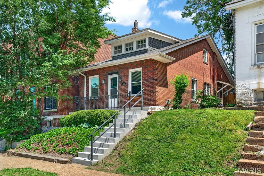Tower Grove Living - This charming home is a commuter's dream! Tucked away just steps from Tower Grove Park includes garage parking and easy bicycle storage from the front basement door! The backyard pergola like something out of the secret garden giving shade and privacy to the patio area. Inside there is main floor bedroom and a second floor bedroom with its own loft for a play room toys or work from home office - additionally zoned hvac provided for increased comfort. The roomy open floor plan is great for entertaining after Sunday brunch or Garden Concert. The basement offers phenomenal work shop potential and room for adding your finishing touches. Enjoy dining down South Grand or the easy access to health care centers and universities. Trade in that leasing life for your very own four walls and fenced in yard with this classic city bungalow.