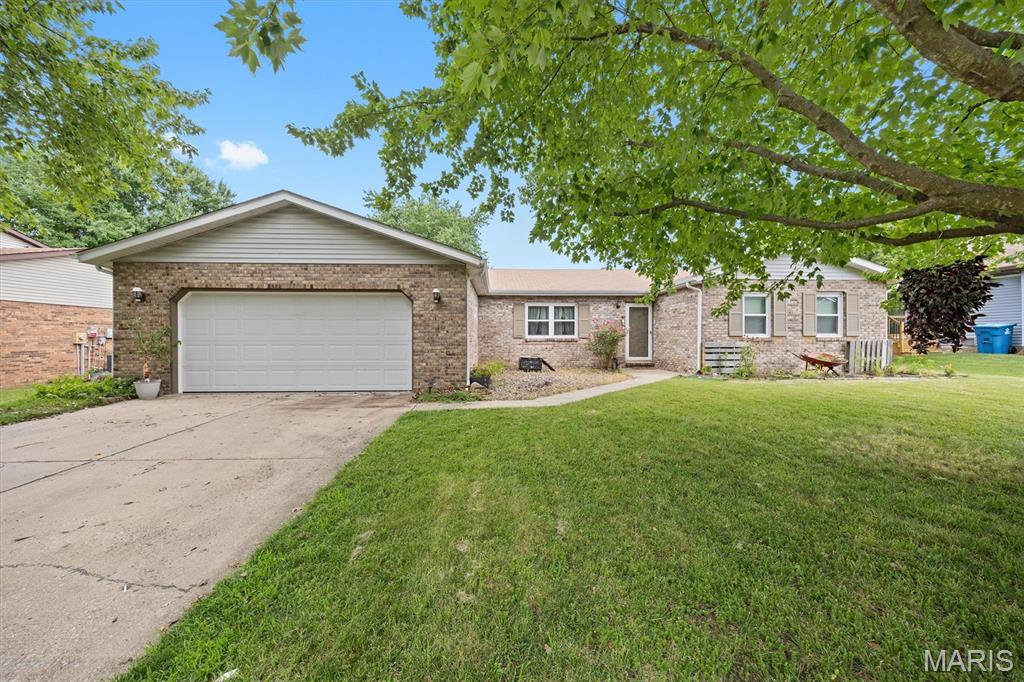 Move right into this beautifully updated brick ranch in a sought-after location! Offering 4 bedrooms and a desirable split-bedroom floor plan, this home combines comfortable living with stylish updates completed over the last three years. The foyer entry welcomes you into the home, with the dining and kitchen area to the left and the spacious living room straight ahead. The vaulted living room features a fireplace and sliding glass doors that open to the backyard. Outside, you'll love the new paver patio - an ideal spot for morning coffee, weekend barbecues, or simply relaxing. The open eat-in kitchen is designed for everyday living with stainless steel appliances, a breakfast bar and plenty of space to gather. The primary suite features luxury vinyl plank flooring, a walk-in closet and its own en-suite bath. Three additional bedrooms and a full bath are tucked away on the opposite side of the home, offering a functional layout for family or guests. Fresh paint, updated flooring and the new paver patio give this home a fresh, move-in-ready feel. Add in the convenient laundry room, attached 2-car garage and fantastic location and you'll quickly see why this home is one you won't want to miss!