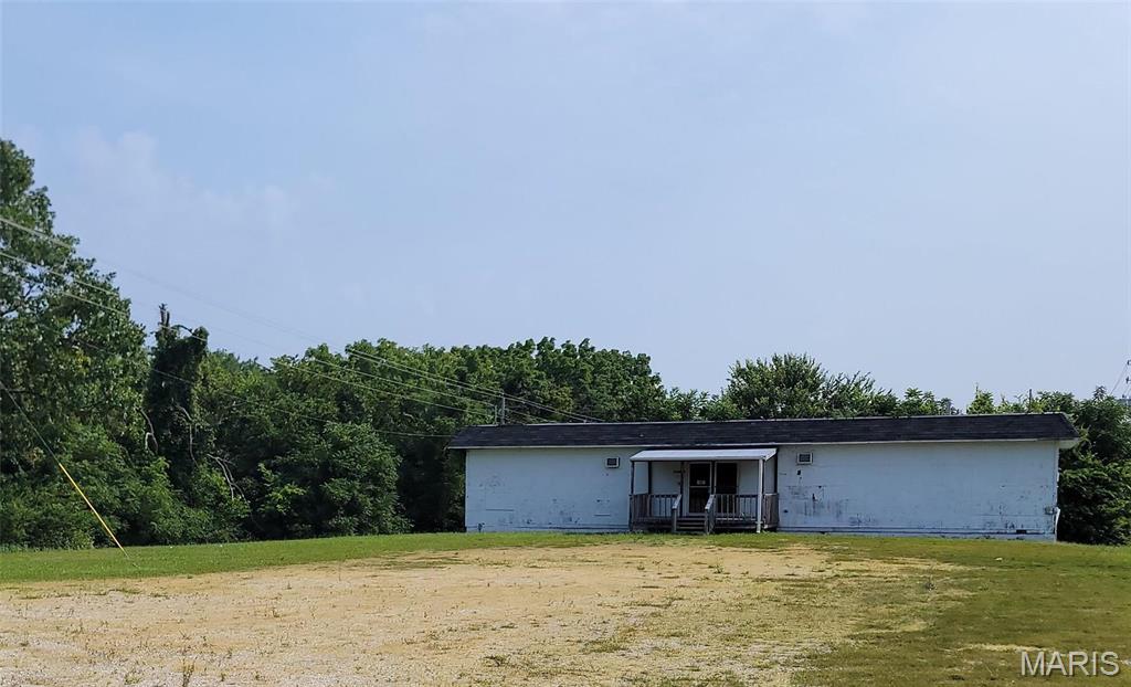 REMARKABLE OPPORTUNITY to own 20+ ACRES on the historic Route 66. Not only does this property have lots of space to operate - it has lots of SPACE TO EXPAND. Historically used by several industries - to include a trucking company who enjoyed the large cleared area for movement.  Current owners have enjoyed the successful leasing opportunities this property has brought over the years. The almost IMMEDIATE ACCESS TO I-44 gives any service industry a distinct advantage to moving product fast. An additional small building previously used as an office would make a great Operations Center with some rehabbing. The large building is move in ready and conveniently has full bathrooms and lots of spaces for offices or storage. The opportunities are endless and your chance to invest in 20+ acres on Route 66....that opportunity is rare these days! Location: City