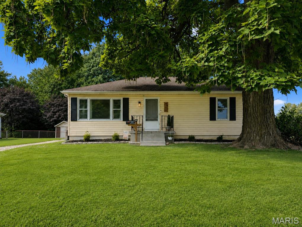 Welcome home to this charming 3 bedroom, 1 bath home offering comfortable living in an easy-to-maintain package. The traditional layout provides a warm and inviting feel, with plenty of potential to make the space your own. Out back, you'll find a large yard with chain-link fencing, offering plenty of room for pets, play, entertaining, or simply enjoying some extra outdoor space. Whether you're looking for your first home or adding to your investment portfolio, this well-kept property is ready for its next chapter. Schedule your showing and come see what this beautiful home has to offer!