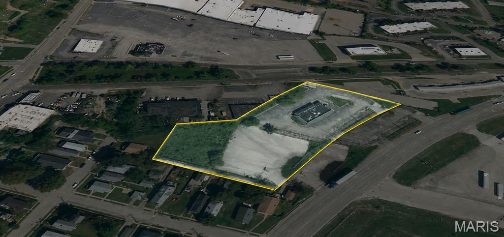 Outstanding commercial redevelopment opportunity at 8889 Hall Street in St. Louis. This 2.48± acre commercial property features a 3,494-square-foot brick building originally constructed in 1982 as a McDonald's restaurant. Zoned "G" Local Commercial and Office, the site offers a wide range of potential uses, including retail, office, restaurant, and service-oriented businesses (buyer to verify permitted use).

Strategically located just minutes from Interstates 270, 70, 55, and 44, the property provides exceptional access to the St. Louis metropolitan area's industrial, distribution, logistics, and riverfront business corridors, including nearby manufacturing facilities and the Port of St. Louis.

Situated on a generous 108,159± square-foot lot, the property offers excellent visibility, ample parking, and abundant space for expansion, redevelopment, or outdoor storage. Whether you're an owner-user, investor, or developer, this is a rare opportunity to acquire a substantial commercial site in one of North St. Louis' premier transportation and industrial corridors.
