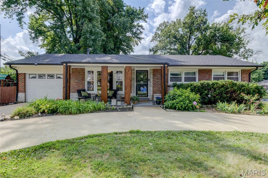 Welcome to Historic Florissant. Beautifully decorated. Thoughtfully updated. From the moment you pull into the convenient circular driveway with ample parking and up to the inviting front porch, you will see the touches put on a house that has been well loved, lived in, and cared for. Step in and explore all the cozy spaces for living and entertaining. The main floor offers a great living dining combo, that walks into a kitchen with custom professionally painted cabinetry, boasting butcher block counters. The beautifully decorated hall spills into three bedrooms and fun vintage bathrooms. Walk out into the sun room, perfect for morning coffee, an office, or homework. Step down into this fantastic basement. Well planned, it offers a media/family room perfectly set up for game watching parties or movie nights. A very playful playroom. A bonus room for office, music, or sleeping. A roughed in bathroom ready to finish. A separate laundry room and separate storage room. The front yard has great curb appeal, the backyard is fenced in and perfect for play, pets, or parties. Don't miss out on this one-of-a-kind property. The owners have enjoyed living here. Family bike rides. Donuts from Old Town, dinners at Hendel's Market, the community on the Florissant swim team. So much great living right outside your door.