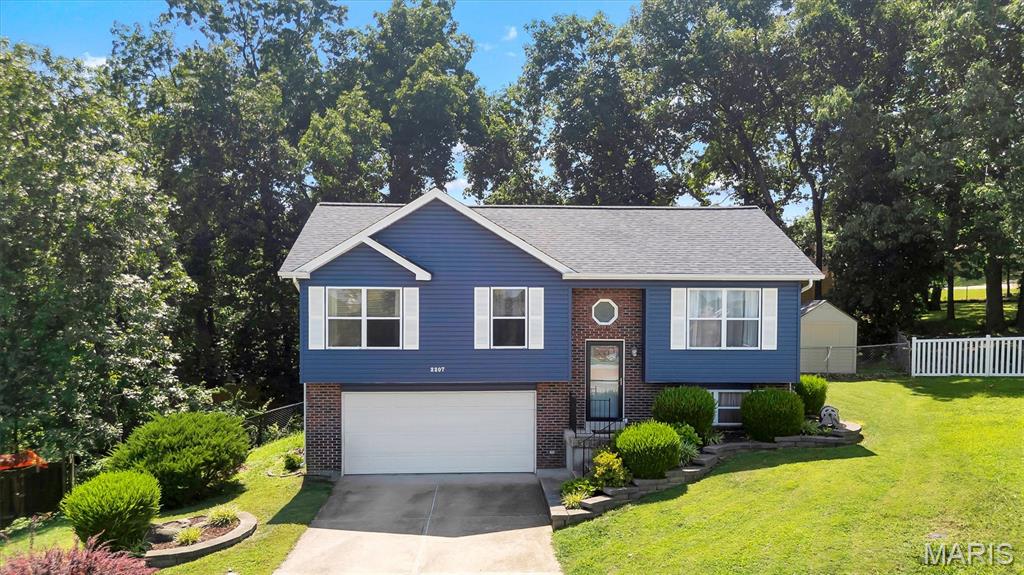 Some homes simply check the boxes. Others create the feeling that you've finally found the one.

Tucked away on a quiet cul-de-sac surrounded by mature trees, this beautifully updated 4-bedroom, 2-bath home offers more than 1,400 finished square feet designed for everyday living and effortless entertaining. From the moment you arrive, you'll appreciate the pride of ownership with a newer roof, siding, and exterior door, creating exceptional curb appeal and peace of mind.

Inside, luxury vinyl plank flooring flows throughout much of the home, while the bright kitchen features timeless white cabinetry and a welcoming space to gather with family and friends. The thoughtful floor plan provides flexibility for growing households, home offices, or guest accommodations.

Step outside and discover one of the home's greatest assets—a generously sized backyard with room to play, garden, entertain, or simply enjoy the privacy provided by the surrounding mature trees. The spacious deck extends your living space outdoors, creating the perfect setting for morning coffee, weekend barbecues, or quiet evenings under the stars.

Completing the package is an oversized garage offering abundant space for vehicles, hobbies, storage, or a workshop.

Conveniently located in the heart of Arnold with easy access to shopping, restaurants, parks, and major highways, this is the kind of home where comfort, updates, and location come together beautifully. Welcome home.