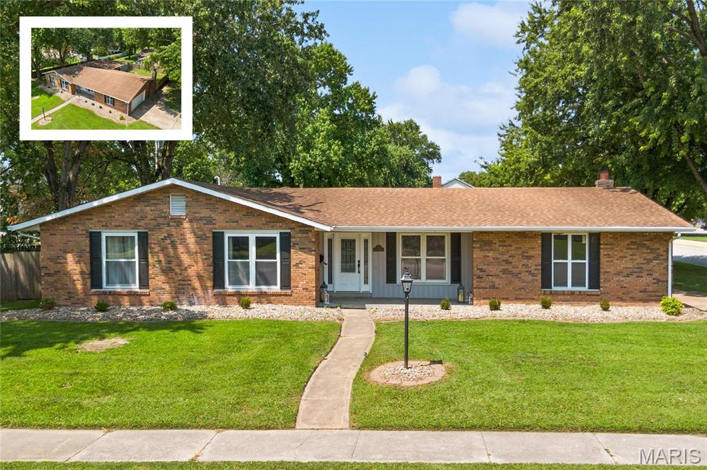 Nestled on an oversized corner lot in the heart of O’Fallon sits this exceptional full-brick ranch offering 5 bedrooms, 3 bathrooms, and a side load 2 car garage. This spacious home combines traditional formal spaces with an inviting kitchen and family room, creating a layout that works exceptionally well for both everyday living and entertaining and all with an unbeatable location right across the street from EK Elementary School in O’Fallon Dist. 90
The welcoming foyer is flanked by formal living and dining rooms before opening to the impressive kitchen, featuring granite countertops, crisp white soft-close cabinetry, stainless steel appliances, modern gray backsplash, and a generous accent island. The kitchen flows seamlessly into the recessed family room, complete with a gas fireplace and direct access to the backyard, creating a natural gathering space for family and guests.
The primary bedroom suite is filled with natural light and features a beautifully appointed bathroom with a floor-to-ceiling tiled, glass-enclosed walk-in shower. Four additional generously sized bedrooms provide plenty of flexibility for children, guests, a home office, or additional living space. The large hall bathroom features dual sinks and a tiled bathtub, while an additional powder room adds convenience.
Outside, the fully fenced backyard offers a concrete patio with dual access points and plenty of space to enjoy the yard. An oversized storage shed provides additional room for lawn equipment, bikes, and seasonal items, while the side-load two-car garage adds both function and curb appeal
A rare combination of space, quality, and convenience in O’Fallon – schedule your appointments today!
