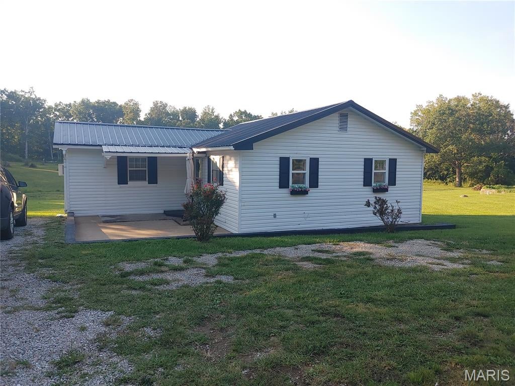 For sale:  2 bedroom 1bath newly refreshed home with so much charm.  From the black and white farmhouse exterior to the backyard, with a view of the neighbors pond, this little house delivers.  Home has new paint throughout, new light fixtures and a recently renovated bathroom with new flooring.  Homes location and condition make it a perfect B&B candidate.  Outside of city limits with affordable utilities, home is centrally located only a mile from Elephant Rocks State Park and all the other attractions in and around Arcadia Vallley.  Just 7 miles to Johnson Shut-In's and Black River and less than 3 miles to shopping and post office this little house is right in the middle of everything visitors would need or want to do.  Would also make the perfect downsize for a couple or even one person to live.   Make your appointment today to see this charmer.