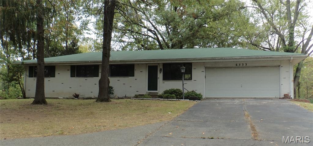 Looking to own an affordable ranch style home with a large private lot?  Wishing you could find such a property in the highly sought after Oakville area?  This home can give you all of that and much more!  Welcome to this delightful 3-bedroom, 2-bath brick home nestled on approximately 3 acres of private land that is just moments away from shopping and restaurants but still feels rural. This almost 1,200 square foot home features a spacious and inviting layout, perfect for comfortable living.  A large outdoor patio, ideal for entertaining and enjoying your privacy is only one way of many you can experience the ample space and tranquility.  A full, unfinished basement and attached 2-car garage give opportunities to add easy living space should it be desired and a private, paved driveway also offers additional off-street parking for anything you need.  Featuring durable and low-maintenance brick construction, this property is perfect for those seeking a peaceful retreat with plenty of outdoor space. Don’t miss the opportunity to make this charming house your new home!
