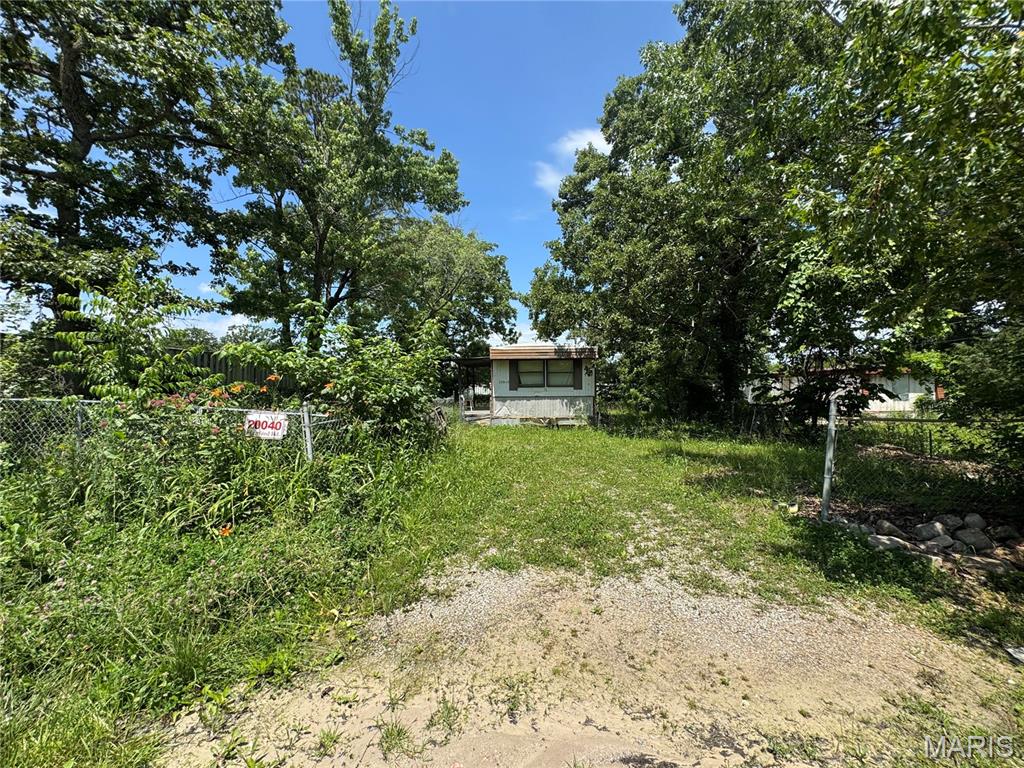 Opportunity awaits with this versatile 0.20 +/- acre residential lot featuring public water, public sewer, and electric already on the property. Mobile homes are permitted, making this an excellent option for mobile home placement or future homesite. An existing mobile home is located on the property and is being conveyed with no assigned value. Buyers & buyers agents are encouraged to perform their own due diligence regarding the condition and suitability of all improvements, utilities, zoning, lot boundaries & subdivision restrictions if any. Conveniently located in between St. Robert & Dixon Missouri and ready for your vision to take shape.