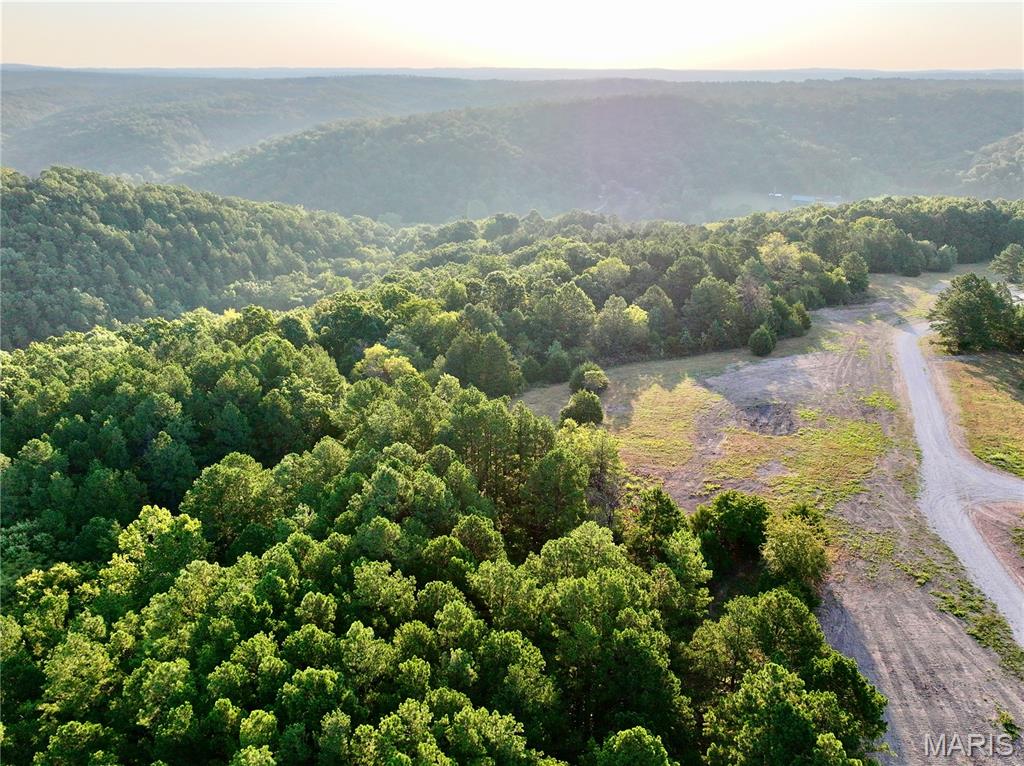 Discover 28.82 acres in the heart of the Missouri Ozarks, ideally located less than 2 miles from Montauk State Park Lodge and Fish Hatchery and approximately 500 yards from a public access point on the Current River. This property offers an outstanding combination of location, privacy, recreation, and natural beauty. Rolling Ozark terrain creates beautiful ridge-top views, while mature, marketable timber provides shade, seclusion, and excellent wildlife habitat. A wet-weather creek winds through the property, adding even more character to the landscape.

Power and well water are already available on site, giving you a great head start for a future cabin, home, hunting retreat, or weekend getaway. An established private drive leads from the county road through an electric gate, providing both security and convenience.

Spend your days trout fishing the waters around Montauk, floating the Current River, hunting, hiking, or simply enjoying your own piece of the Ozarks. With Montauk State Park, the fish hatchery, and river access all just minutes away, recreational opportunities are hard to beat. Additional adjoining acreage is also available upon request, offering the opportunity to expand your investment or create a larger private retreat.
