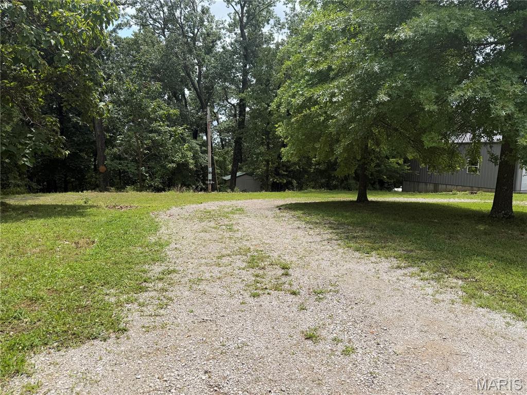0.35-acre Building or Camping lot. It's perfect if your future plans include living or camping in a gated Lake Community. There is something for everyone to enjoy including hunting, fishing, hiking, swimming or any other outdoor activity that includes nature and water. Water and Electric is already set up and there is a level area perfect for a camper.