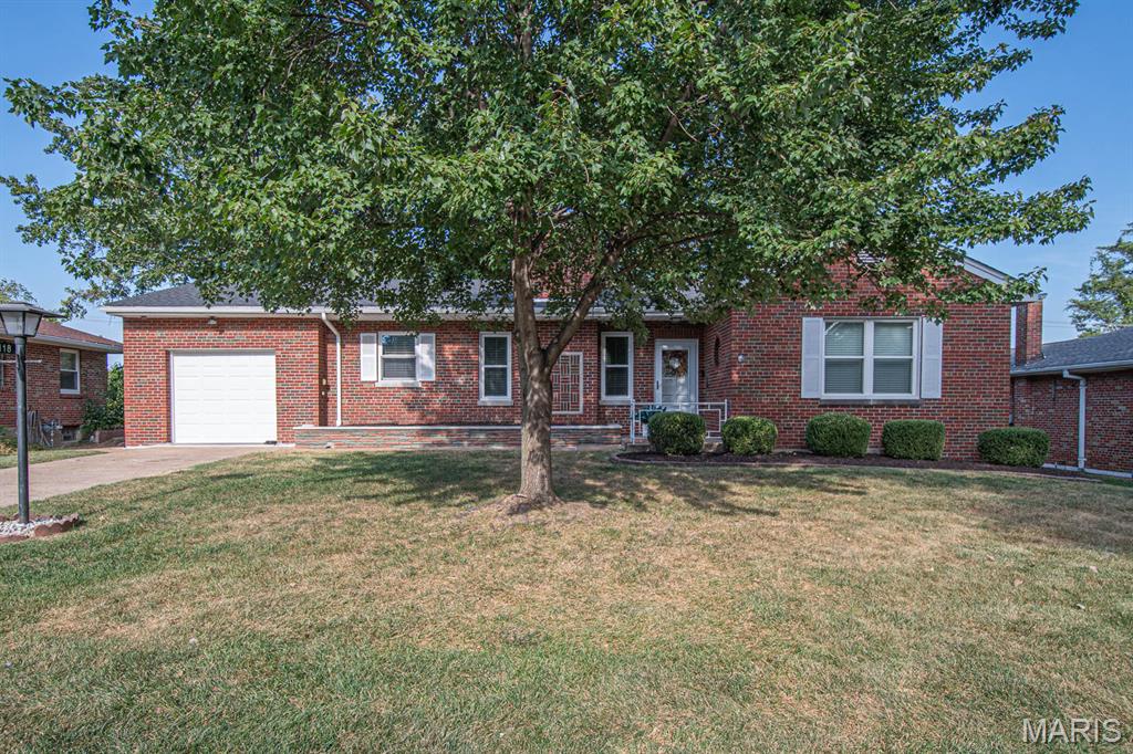 Welcome Home! St Louis City Living with a county feel!  Open Concept Living, Brick Ranch in the VillaNova neighborhood, offers 2 bedrooms, 2 full baths, updated kitchen and bath, partially finished basement, w/ a 1 car attached garage and level, fenced yard. NEW Roof Sept. 2026!  As you step in the front door you will notice the open floor plan: Spacious living room w/ fireplace and living room leads seamlessly into a breakfast area and updated kitchen w/ granite tops, pantry, S/S appliances, center island w/ seating area and is great for entertaining. The view of the flat back yard extends your space out onto the outdoor patio seating area. Large primary bedroom has a HUGE walk-in closet! OOOooooo!  Tastefully Updated full bath w/ tub/shower combo w/ custom tile and has a covenient vanity area. Two additional hall closets are nice for all the extras and finally, the 2nd bedroom completes the main floor.  Downstairs find the partially finished lower level w/ family room, bar room w/ beverage refrigerator, hall seating/reading area and full bath w/shower. Storage/laundry and utility rooms round off the basement.  Attached 1 car garage w/ interior house access. Must see this one in person! Updates include: Roof '26, Fence '24, Windows, Kitchen, and bath.