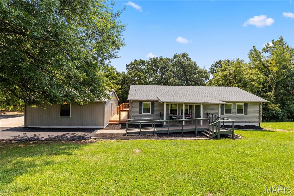 Welcome to 746 Schluersburg Rd! This home sits on 3 acres in a quiet, unincorporated St. Charles County neighborhood in Augusta.

The main level features a newly updated kitchen with quartz countertops, new cabinets, and stainless steel appliances. The primary and hall bathrooms have been updated with new tiled shower surrounds, while new LVP flooring and carpeting run throughout the main level. You’ll also find new lighting and hardware throughout the home, along with a new A/C system, new water heater, and a newer roof (about 5 years old). Main floor Laundry Room is an added bonus!

The lower level offers a rec area, a family room with access to the rear yard, a full bathroom with a tiled shower surround, new carpeting, plenty of storage space and a walk-out basement.

Outside, enjoy the new deck, covered front porch, a two-car detached garage, small pond, and a storage shed. With plenty of room to enjoy the outdoors and updates throughout the home, this property offers a great opportunity to settle into a peaceful setting in Augusta.

Come take a look and see what 746 Schluersburg Rd has to offer!