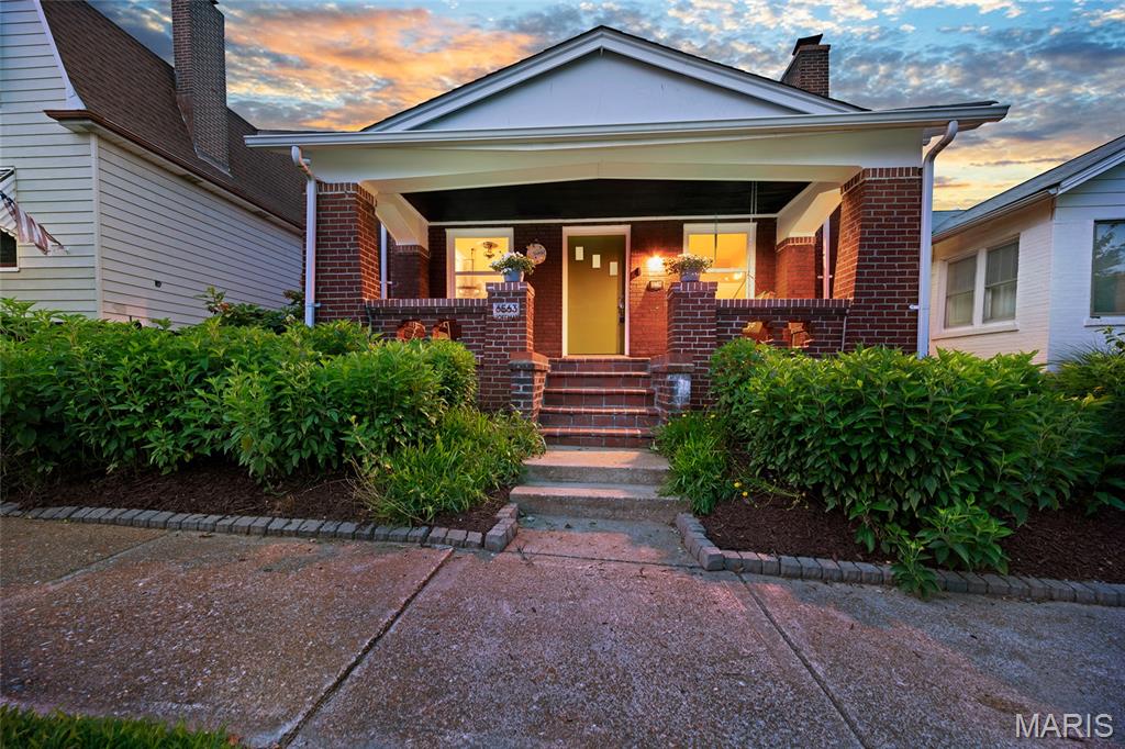 Looking for something that is the perfect mix of Adorable and Affordable? Well look no further than 6563 Hoffman Ave! Prepare to be abundantly enamored with this absolutely CHARMING full-brick 3-bedroom, 2-bath bungalow on a quiet, tree-lined street in the highly sought-after Clifton Heights neighborhood! From the inviting covered front porch to the beautiful stained glass windows and rich wood floors, this home is filled with timeless character and classic South City vibes. The spacious living room opens to a separate dining room, creating a comfortable layout for everyday living and entertaining. The eat-in kitchen offers generous cabinet and counter space while preserving its original charm. The upstairs primary suite is an absolute SHOW STOPPER!! It features a full bath with a stunning dual zone shower, separate vanities and HEATED TILE FLOORS. Don't forget to take a peek at the extra storage behind the hidden door bookcases! The primary suite also features a flex room that could function well as a huge walk in closet, a work from home office, or would make a wonderful room to pursue your artistic endeavors or burn your early morning calories in your Peloton studio! Main floor boasts two spacious additional bedrooms. The zoned HVAC system here keeps ALL levels of the home comfortable year round. The main floor full bath is also well appointed and updated.  Just off the kitchen, the bright all-seasons sunroom provides the perfect space to relax, work from home, or enjoy views of the kiddos and pups bounding about in the flat fenced backyard. A detached one-car garage also offers convenient off-street parking. Enjoy all the conveniences of Clifton Heights: just moments from Clifton Heights Park, The Hill, Forest Park, The St. Louis Zoo, and amazing local restaurants (Los Arcos, Biggies, Vinnie's, LeGrands, Pizza a Go Go - to name just a few!) shopping, and easy access to Highways 44 and 40/64. Don't miss your chance to call this one HOME!