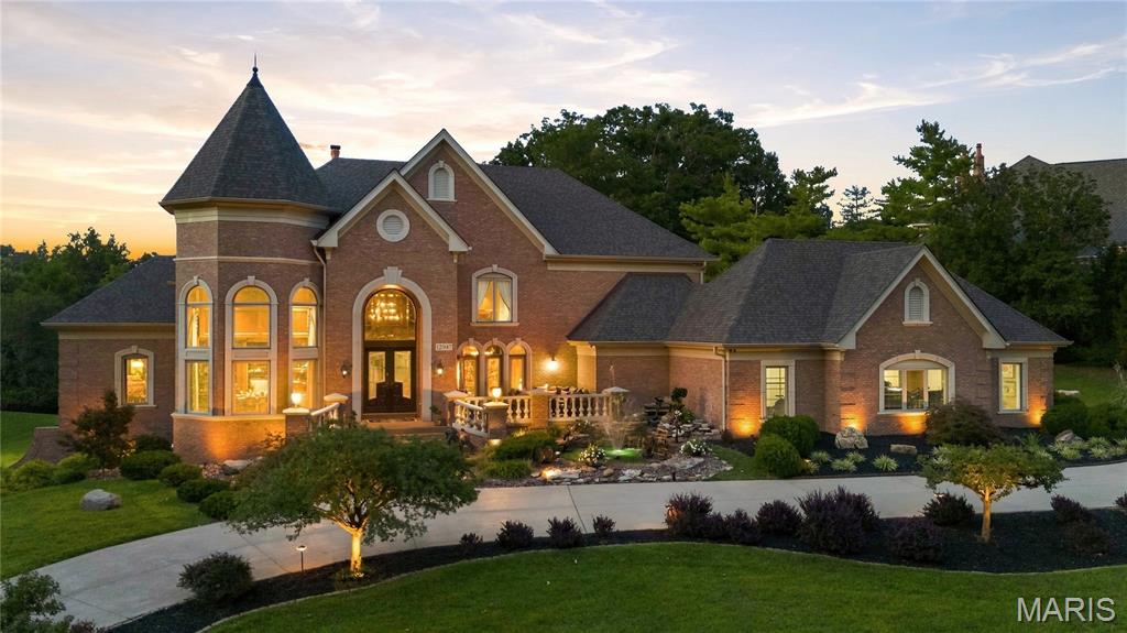 Experience unparalleled luxury in this magnificent 9,400+ square foot executive estate nestled in the heart of prestigious Sunset Hills. Thoughtfully custom-designed and offered fully furnished and decorated, this extraordinary residence showcases an impressive collection of fine furnishings including many pieces imported from Europe. Inspired by the timeless elegance of the Bellagio, this one-of-a-kind home delivers a five-star resort lifestyle unlike any other. 

Upon entry, guests are greeted by a grand marble foyer with winding staircase, soaring ceiling and exceptional architectural craftsmanship throughout. Stunning crown molding, rich woodwork and various intricate ceilings grace this home -- creating an atmosphere of sophistication and grandeur.

The luxurious primary suite is a private sanctuary, featuring a spa-inspired bath and an exceptional walk-in dressing room with floor-to-ceiling custom storage and display cabinetry designed to showcase an extensive wardrobe collection. A distinguished private office with rich wood-paneled walls provides the perfect executive workspace. The second floor features 3 additional private ensuite bedrooms complete with full baths and walk-in closets.

Designed for both elegant entertaining and comfortable daily living, the gourmet kitchen features marble countertops and flooring, premium Viking, Breville, and Sub-Zero appliances, and opens to a stately hearth room highlighted by a dramatic stone fireplace and custom built-ins. The formal dining room is beautifully furnished and includes an exquisite Versace china and flatware collection, creating a truly memorable setting for entertaining.

Just beyond the dining room, a spectacular lanai overlooks a serene koi pond, seamlessly blending indoor and outdoor living. The walk-out lower level is an entertainer’s dream, complete with a home theater, ornate pub-style bar, billiard room, player piano, wine collection, spacious game room, expansive family room with stone fireplace, private , full bath, bedroom and abundant storage.

Step outside to your own private resort-style oasis surrounded by mature trees and beautiful landscaping. Enjoy the heated saltwater pool, decorative fountain and waterfall, outdoor fireplace, outdoor entertainment station and beautifully designed grounds that create an atmosphere of tranquility and exclusivity.

Automobile enthusiasts will appreciate the heated, fully finished five-car garage, complemented by a generous driveway capable of accommodating up to ten additional vehicles.

Additional luxury amenities include: Smart home technology, Sophisticated security system, New tornado resistant & security window glass on main and lower levels, Indoor and outdoor bronze statuary and new roof (2026). Perfectly suited for a discerning executive, luxury relocation buyer, or multigenerational family, this exceptional estate offers an unrivaled lifestyle just minutes from Sunset Country Club and Laumeier Sculpture Park. A rare opportunity to own one of Sunset Hills' most distinguished luxury residences. Immediate possession available.