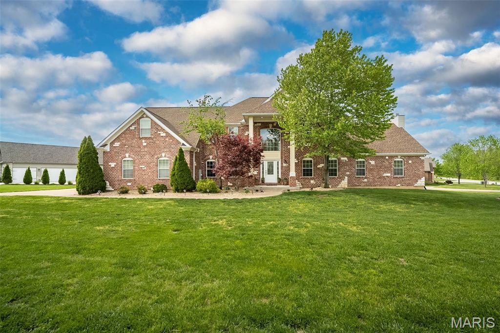 Seller is offering a 1-year interest rate buydown with acceptable offer—enjoy a rate 1% below market for your first year of homeownership!

A true estate presence in sought-after Ming Estates — designed for those who need space without compromise! Set on a rare .58-acre corner lot in Washington, MO, this exceptional brick-front home offers over 5,900 sq ft of finished living space, paired with extensive recent upgrades that allow you to step right into a fully realized home — no projects, no waiting. From the moment you enter, the scale is undeniable. A dramatic two-story foyer with arched and barrel-rolled ceilings creates a grand welcome, framed by a formal dining room and a private office or reading room — spaces that feel both refined and intentional. At the heart of the home, the kitchen was built to handle real life at full capacity — featuring custom cabinetry, granite countertops, center island, pantry, and planning desk — all opening seamlessly into the vaulted great room with gas fireplace. It’s the kind of layout that keeps everyone connected, whether you're hosting a crowd or managing the rhythm of everyday life. Step outside and the experience continues. The newly completed $49,000 composite deck with integrated post lighting offers a polished outdoor extension — overlooking the expansive corner lot and creating the perfect backdrop for evenings, gatherings, and everything in between. Upstairs, five true bedrooms provide a rare level of flexibility — ideal for larger households, multi-use spaces, or simply room to grow. The vaulted owner’s suite stands apart as a private retreat, complete with its own gas fireplace, jacuzzi tub, and spacious bath. The finished walkout lower level adds an entirely separate living experience — featuring a full second living area, rec/media space, full bath, and a 6th sleeping area or guest suite. Whether for extended family, long-term guests, or private quarters, the possibilities here are exceptional. Seller is offering 1 year home protection plan for added buyer confidence!

Recent improvements have already elevated the home:
• New Roof – $29,000 (May 2025)
• Composite Deck – $49,000 (July 2025)
• Fresh Interior Paint (Sept 2025)
• LVP Flooring in Lower Level (Sept 2025)
• New Carpet in 6th Bedroom (Sept 2025)
• $10,000 Insulation & Pest Treatment (Aug 2025)

This is where space, function, and lifestyle come together in all the right ways!