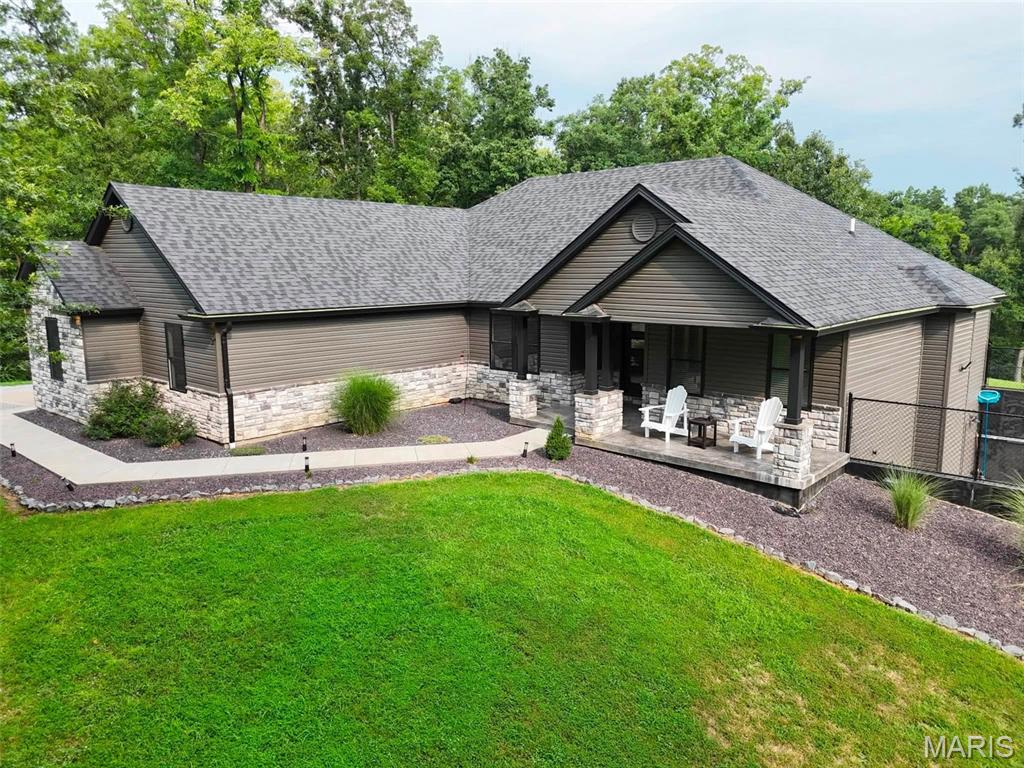 Welcome to one of the most beautiful properties to ever hit the Hannibal market! Recently built 3,200+sqft home with premium features/finishes, massive in-ground pool, sitting on 12.4 acres inside city limits, but tucked away out of the noise. Inside you will find an open floor plan accented with a stone fireplace, premium flooring, the most stunning kitchen in town with ample room to host, & too many intricate details to list that make this forever home a true work of art. The primary bedroom conveys a spacious walk-in closet & spa-like bathroom ensuite you have to see in-person to fully grasp. Downstairs in the full basement, you'll find pool access, a kitchenette to enjoy just steps from being poolside, an enormous secondary family room, & everything necessary to never have to walk up the stairs. Properties like this don't present themselves often, so don't let it slip away!