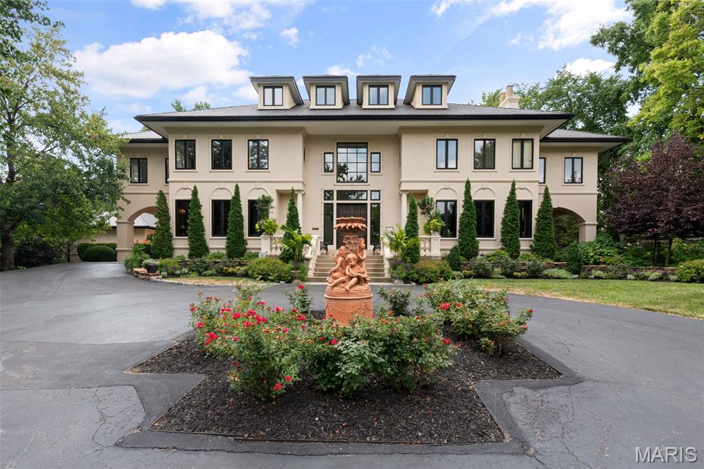 Welcome home to 441 Park Road ... a realm of refined luxury nestled on a little more than an acre in sought-after Webster Park. Boasting nearly 7,000 square feet of exquisitely crafted living space, this home offers an exceptional blend of elegance and comfort. Lush landscaping, a charming porte-cochere, and a covered terrace draw you inside. Upon entering, you're greeted by soaring ceilings, intricate millwork, a grand staircase, arched entries, and gleaming floors. The main level features a formal living room and elegant dining room that offer distinct areas for entertaining guests, as well as a sizable office with custom built-ins, a spacious kitchen with a bayed wall of windows and a breakfast nook, and a stunning two-story family room. There's also a butler's pantry / wet bar, laundry room, and mudroom with cubbies, 2nd fridge and pantry. On the second floor you'll discover the spacious primary suite, complete with a luxurious bathroom with a large walk-in closet with washer / dryer, a wall of French doors opening to a private balcony, and double doors leading to  your private sitting room. An en-suite bedroom and two additional bedrooms with a Jack and Jill bath are also located on this floor. The walk-up third floor has a versatile rec room or playroom, two bedrooms, and a full bath. The deep pour lower level has rec space, loads of storage, the fifth full bath, plus a wine room tucked behind a bank vault door...all this and outdoor access too.
