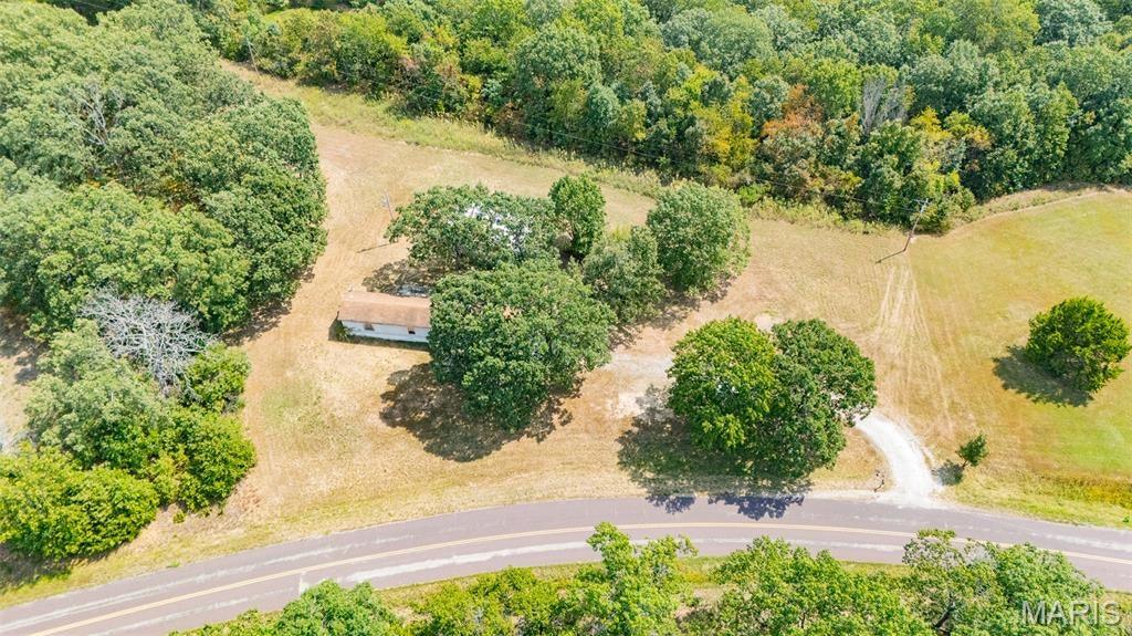 Bring your vision to life on 6.77 beautiful acres m/l in Vichy!  Offering spectacular views and the freedom of NO RESTRICTIONS, this property provides an excellent opportunity for a homestead, recreational retreat, or future building site just minutes from Rolla. The property already has well, septic, and electric service established, making it a great starting point for your plans. A pond adds to the natural appeal, while the detached shop provides valuable storage or workspace. A mobile home is currently on the property and is being sold as-is with no contributory value; buyers may choose to renovate it or remove it and create something entirely new. Enjoy the privacy and peaceful surroundings of country living while remaining conveniently close to Rolla amenities. Beautiful land, established utilities, a pond, a shop, spectacular views, and no restrictions—this property is full of possibilities!