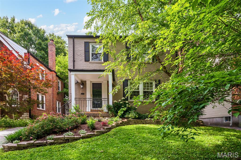 Beautifully updated 3-bedroom, 2.5-bath University City home delivers the character everyone wants with the updates nobody wants to tackle. Inside, you'll find hardwood floors throughout, spacious living and dining areas, updated fixtures, and a cozy gas fireplace perfect for movie nights, snow days, or pretending you'll read that book you've been carrying around for six months. The custom-remodeled kitchen is the heart of the home, featuring custom cabinets, stone countertops, stainless steel appliances, and thoughtful finishes that make everything from weeknight dinners to weekend entertaining feel effortless. The upstairs bathroom has been completely reimagined with a stylish, modern renovation and features a double vanity and heated floors. Finished lower level offers additional living space and another renovated, full bathroom for when that friend from college or your mother-in-law (who genuinely means well) overstays their welcome. Outside is where this home really shines. The newer deck, screened-in porch, stamped concrete patio, and full-fenced backyard create the kind of indoor-outdoor living space that's hard to find. Enjoy morning coffee, neighborhood happy hours, kids chasing fireflies, grilling with friends, or the perfect escape from your family. The major systems have already been addressed with updated plumbing, thermal-efficient windows, a new electrical panel, new hot water heater, and an EV charger. Translation: less time on home projects and more time enjoying your weekends on aforementioned deck and patio. Located just minutes from Clayton, The Loop, Forest Park, and major highways, you'll have an easy commute and quick access to some of the region's best dining, parks, and entertainment. Character. Location. Updates. Does it get any better?