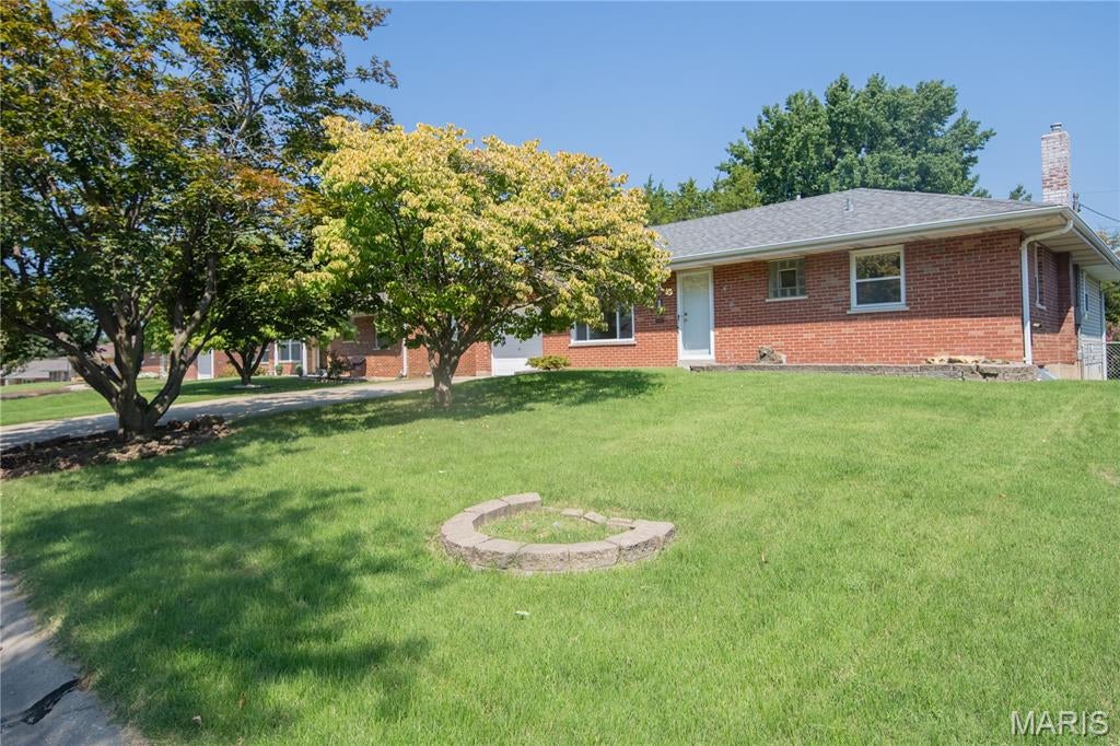 Welcome to 5013 Stellamac Drive! This charming brick ranch offers more space than meets the eye, beginning with beautiful hardwood floors and timeless original details throughout. The inviting living room features a large picture window while the separate dining includes a larger space to have meals.  The kitchen provides plenty of cabinetry and a breakfast area. Off the kitchen and dinning room is the primary bedroom—that features an ensuite shower, closet, and laundry. Two additional bedrooms and a full bath complete the main level. Downstairs, the partially finished basement expands your living options with a recreation area, additional bathroom, and plenty of storage. The level backyard with beautifully maintained landscaping completes this centrally located Affton home. Move in and enjoy its classic character or add your own finishing touches over time!