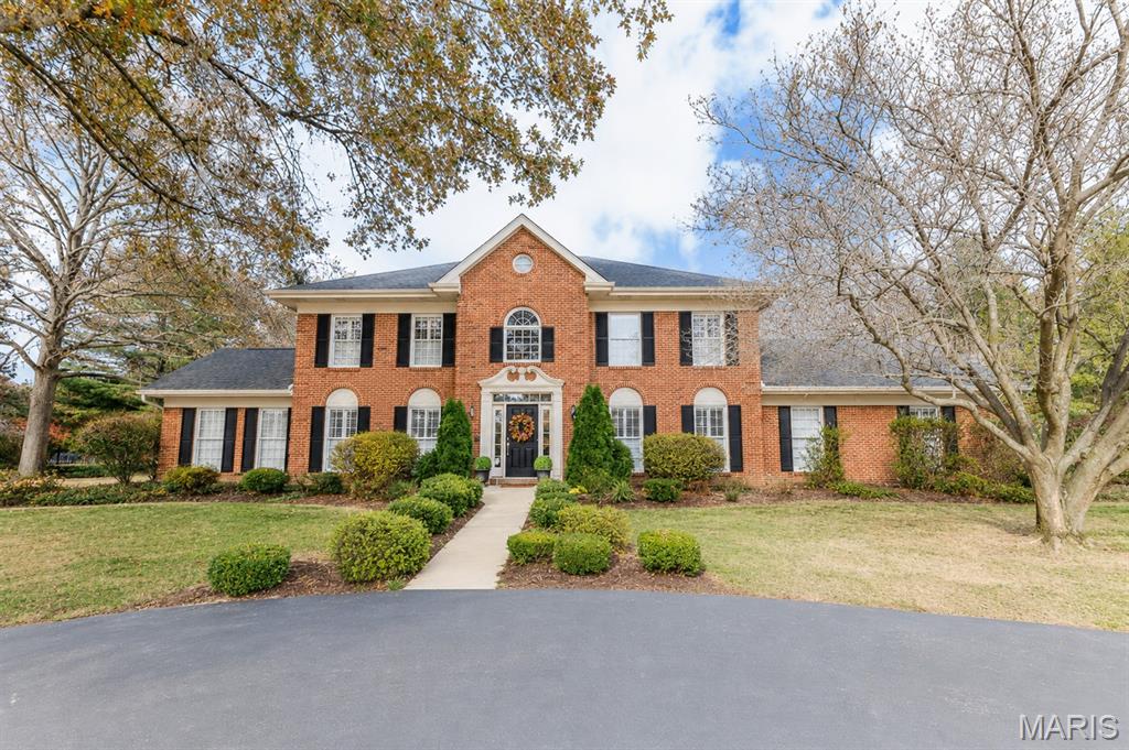 This exceptional property with a Colonial style home is positioned on an 1 acre lot with lush landscaping surrounding it, in sought after Ravenwood Lake Estates. The entertainment ready home boasts Inviting circle driveway, approximately 5500 sq.ft. of living space, and includes a private in-ground pool. The 2-story entry foyer with a sweeping staircase, is flanked by the freshly painted formal dining room and french doors that open into the living room with separate office. The classic family room has a gas fireplace & wetbar for entertaining and opens to the light, bright sunroom with vaulted ceiling, wood flooring and another gas fireplace. The gourmet kitchen features custom blonde cabinets, a center island, black granite countertops, high-end stainless steel appliances, and a breakfast area with built-in desk. Oversized, main floor laundry & half bath are conveniently located. The primary bedroom with a plush ensuite bath includes a large walk-in closet, double vanity, walk-in shower, whirlpool tub and private commode. 3 additional, spacious bedrooms and a full bath complete the Upstairs level. The Finished lower level offers an additional family room with a gas fireplace, a wet bar equipped with a sink and lots of shelving, a rec area for games/cards and a game table, and an additional staircase. Private fenced-in yard is an entertainer's dream, with a huge brick pavers and concrete patio for dining, lounging around the pool, and sitting by the firepit. Conveniently located to schools, shopping, dining and medical facilities. This beautiful home is a Must See!