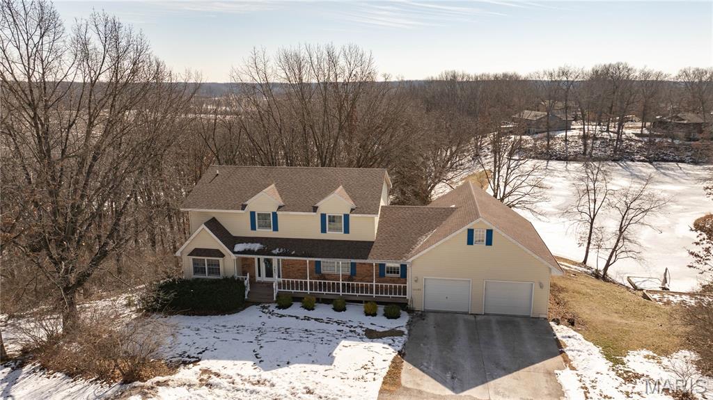 Situated at the end of a quaint cul-de-sac, this beautiful lakefront home blends comfort, space, and everyday functionality with peaceful water views. Selling as is - all inspections welcome.


Step into the two-story entryway surrounded by a private office on one side, perfect for working from home, and a spacious dining area on the other. The spacious living room features sliding doors that open to an elevated deck that overlooks the lake. The eat-in kitchen with breakfast room, creates a natural gathering space for family and friends.

The kitchen is a standout, complete with a center island with breakfast bar, and sliding doors from the breakfast area leading directly to the deck, making indoor/outdoor living effortless. A convenient mudroom, and main-floor laundry round out this highly functional main level.

Upstairs, the primary suite feels like a private retreat with serene lake views, a walk-in closet, and an ensuite bathroom featuring a walk-in shower and double sinks. 

The fully finished walk-out lower level expands the living space even further with a large rec area and family room with direct access to a paver patio. The 4th bedroom with a walk-in closet and a three-quarter bathroom makes this level ideal for guests or extended family. A generous storage room and dedicated mechanical space add practicality without sacrificing style.

With central air, a flexible layout across three finished levels, and a prime lakefront setting, this home offers the perfect blend of everyday comfort and relaxed waterfront living. A rare opportunity to enjoy space, privacy, and scenic views all rolled into one exceptional property.
