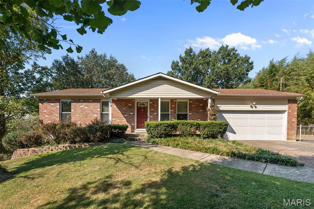 **WELCOME HOME!!** Offering more space than meets the eye, this property features a finished lower level plus an impressive oversized 20' x 30' insulated 2-car garage—perfect for vehicles, a workshop, hobbies or extra storage. The finished lower level provides valuable additional living space, including a non-conforming room ideal for a home office, hobby room or flex space, along with a large laundry room featuring generous storage and a dedicated folding area. On the main level, you'll find an updated bathroom and a well-equipped kitchen with all stainless steel appliances. Step outside to enjoy the fenced backyard, offering plenty of room for entertaining, pets or simply relaxing outdoors. An asphalt driveway provides convenient additional parking. Situated on approximately a half-acre, this home delivers the living space, storage and oversized garage you've been searching for—inside and out!