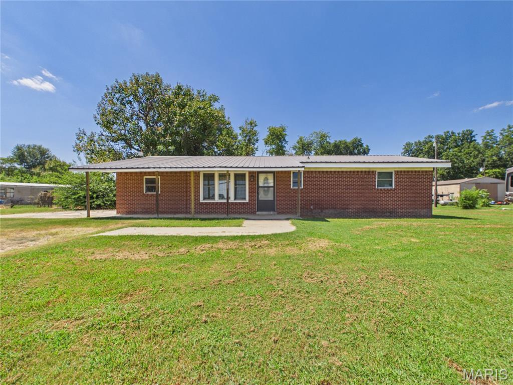 Welcome to this 1,431-square-foot brick ranch home on a level 0.45-acre lot in Malden, Missouri! Featuring classic brick construction, a durable metal roof, and insulated windows, a concrete foundation, this property presents a high-potential opportunity for investors or buyers looking for a custom renovation project.
The floor plan includes 3 bedrooms, 1.5 bathrooms, 7 total rooms, and a main-level laundry room. Central air and electric forced air heating are already in place, along with public water and a private septic system. Outside, enjoy a covered front porch and a generous lot in a quiet unincorporated neighborhood within the Malden R-I school district. Bring your vision and contractor to unlock maximum equity in this classic Dunklin County home. Sold as-is; ideal for cash or conventional financing.