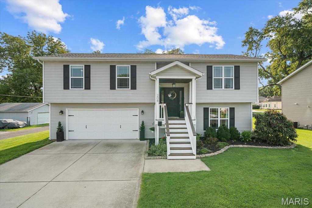 Experience modern living at its finest in this beautifully designed 3-bedroom, 2.5-bath split-level home built in 2018. The light-filled main level showcases an open-concept design that seamlessly blends the spacious living room, dining area, and stunning kitchen, creating an inviting space for both everyday living and entertaining.

The stylish kitchen is the heart of the home, featuring stainless steel appliances, a center island with seating, abundant cabinetry, and an effortless flow into the main living areas. Clean lines, contemporary finishes, and an airy, spacious feel give this home a timeless appeal.

The finished lower level offers exceptional versatility with a spacious second living area, a convenient half bath, and flexible space for a home office, game room, or media lounge. Completing the home is an attached two-car garage and a generously sized, fenced backyard—perfect for entertaining, pets, play, or simply relaxing outdoors. Thoughtfully designed and move-in ready, this home blends modern style, comfort, and everyday functionality.
Call your favorite agent and schedule and appointment or see us at the open house on Saturday, Aug. 15th 11am-1pm.