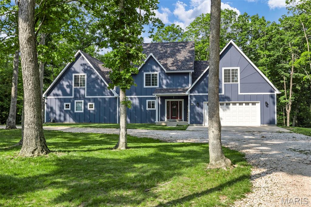 MOTIVATED SELLER! Newly built, MASSIVE 1.5 Story located just 12 minutes from the heart of Troy with NEW roof December 2025. This private, low density neighborhood gives you the rural setting you've been searching for without sacrificing commute and convenience. A large, level, wooded lot with a massive circle drive greets you as you arrive. Newly built and packed full of updates, this 5 bed / 4.5 bath / 1.5 story home boasts almost 4,000 sqft of finished living space. An entertainers dream kitchen featuring a HUGE island and spacious living room with floor to ceiling custom built-ins! Main floor master suite - Separate tub/tiled shower, his & her vanities and his/her walk in closets WITH a private covered deck. 2nd story features 4 additional bedrooms, 2 full bathrooms, and oversized loft ( perfect home office or game room ) Partially finished lower level with full bathroom, Tankless water heater, Humidifier, water softener, whole home water filtration system w/ UV light, Dual HVAC, Black Slate appliances, & oversized/insulated garage! A MUST SEE!