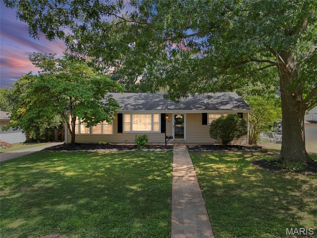 Webster Groves School District for under $300,000! This charming 2 bed, 1 bath ranch offers an updated interior, great entertaining space & tons of potential! Step inside to a spacious dining area that flows into the updated kitchen featuring granite countertops & beautiful white cabinetry. Just one step down, the light-filled living room offers a cozy space to relax or entertain. Two spacious bedrooms with generous closet space & an updated full bath complete the main level. Downstairs, the unfinished basement is ready for your vision! The seller had plans drawn up to finish the space, and framing/studs are already in place should the new owner choose to follow through—perfect for future rec space, a home office, gym or movie room. Outside, you'll love the fully fenced backyard with plenty of room for pets & entertaining, a wooden patio for grilling and a raised garden bed ready for your green thumb. Updated, move-in ready & full of future potential in the sought-after Webster Groves School District—schedule your showing today!