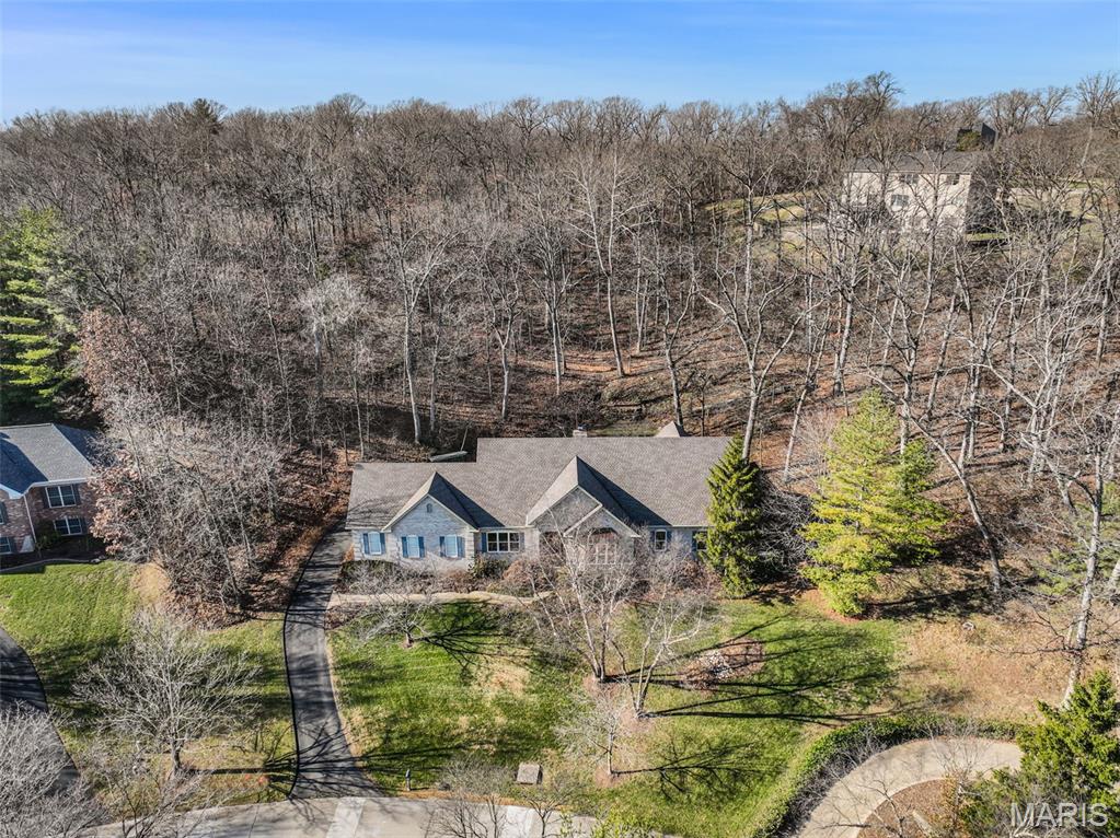 This spectacular sprawling ranch home in sought after area of Sunset Hills is a show stopper! Right across from the golf course and 2940 sq. ft. just on main level with a fully finished beautiful lower level. Peace and quiet, one level living and easy location to everywhere here. Quality everywhere from built ins, coffered ceilings, huge master bedroom with all updated master bath . This home sits up overlooking peace and trees, backs to a nice patio with lots of privacy! Plantings and landscaping are showcased in the pictures from spring and summer mornings and evenings of enjoyment, truly professionally landscaping.   Move in ready and quickly dont wait. MANY RECENT UPDATES INCLUDING ROOF, HARDIE BOARD SIDING, FASCIA, TUCKPOINTING ON CHIMNEY, NEW HVAC SYSTEMS. Front porch has retractable screen. Walk into office or den w built ins , formal ding room off kitchen, then the great room overlooking fireplace, patio and extreme tranquil yard right here in beautiful coveted Sunset Hills. 3 car garage is 30 x 26, extra storage galore, with workbenches.   Crown molding and Trey ceilings in great room, dining room and master.  extra big and deep! Golf to your hearts desire and its right across the street, which also provides the nice quiet, private atmosphere.