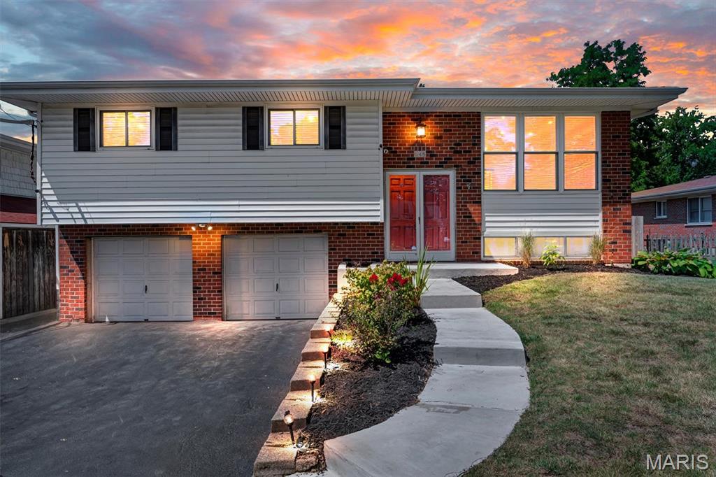 Welcome to this beautifully updated 4-bedroom, 2.5-bath split-level home in the desirable Mehlville School District! Fresh paint and cosmetic updates throughout create a bright, inviting feel, while abundant natural light and an open-concept layout make the home feel spacious and welcoming. The main level features four bedrooms, including a spacious primary suite with its own private en-suite bathroom, plus an additional full bathroom. The kitchen offers stainless steel appliances, a gas stove, and plenty of functionality, opening to a separate dining area perfect for everyday meals or entertaining. The finished lower level provides additional living space with a comfortable family room and convenient walkout access. Outside, enjoy the oversized back deck overlooking the fenced backyard—ideal for relaxing, entertaining, or enjoying your morning coffee. A two-car attached under-garage provides convenient parking and additional storage. Major updates include a new roof installed in 2025 with a lifetime warranty, and a new water heater installed in 2026, providing added peace of mind. With its functional layout, modern cosmetic updates, natural light, and fantastic outdoor space, this home is ready to welcome its next owner!