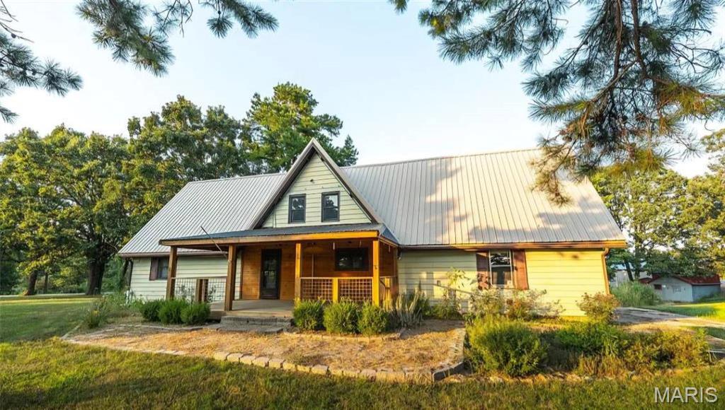 Escape to the perfect blend of country living and modern convenience with this beautifully updated 3 bedroom, 2 bathroom home on 5.35 acres m/l just minutes from the amenities of Rolla. Ideal for hobby farmers or anyone craving extra space, this property offers endless possibilities with a detached 2-car garage, poultry coop, mature peach, plum & pear trees, garden area, and an impressive 60x80 shop featuring an 8-inch concrete floor and the potential for electric service. Inside, you’ll love the redesigned interior layout, updated lighting, and fresh paint throughout. The spacious kitchen boasts brand-new cabinetry and plenty of room for gathering and meal prep. An unfinished basement provides additional storage space and includes the laundry area. Geothermal heating and cooling offer quiet, energy-efficient comfort year-round. The property is equipped with two septic systems — one just 5 years old and the other 3 years old — plus a well with a new pump installed last year. Previously accommodating an additional mobile home, this versatile acreage offers 2 electrical services and is ready for your vision. Enjoy peaceful rural living with room to grow, all while staying close to town conveniences.