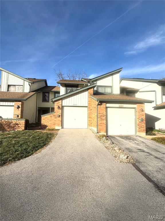 Updated 3-bedroom, 1.5-bath townhouse in desirable Maryland Heights featuring new carpet and a modern kitchen with refrigerator, range/oven, dishwasher, microwave, and new quartz countertops. Main level offers a cozy family room with fireplace, separate living room, and half bath—perfect for entertaining. Upstairs includes a spacious primary bedroom with updated full bath and two additional bedrooms. Finished basement, HVAC 2022, and community amenities including an outdoor pool. Move-in ready and a must-see!