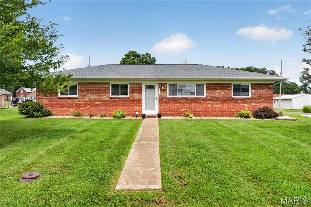 Welcome home to 261 E. Back Street in Hecker! This move-in-ready, all-brick home offers 3 bedrooms, 2 bathrooms, and a bright, open layout with plenty of space to spread out. Updated LVP flooring flows throughout the main living areas, while the spacious kitchen features an abundance of custom cabinetry and a convenient breakfast bar—perfect for casual meals or entertaining.

A second full bathroom was added in 2024, and the oversized laundry room provides even more functional space. Outside, you’ll love the adorable back patio with plenty of room for relaxing, grilling, and hosting friends and family. The 24x24 detached two-car garage features concrete floors, and the drive-through driveway offers easy access and plenty of additional parking.

Solid, spacious, and ready for its next owner—this Hecker home is one you won’t want to miss!