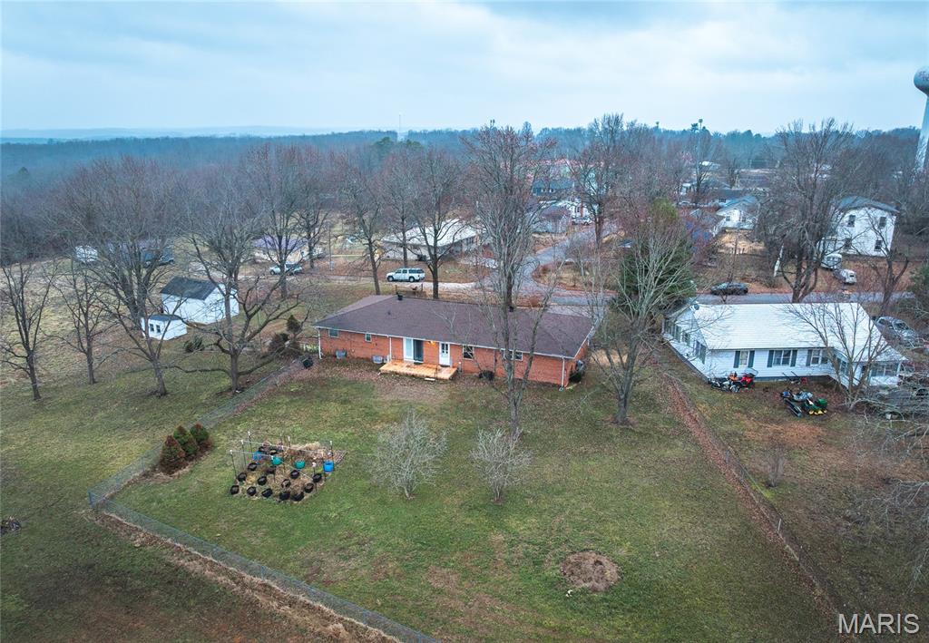 Spacious all-brick ranch located in the heart of St. James on approximately 2 acres. This well-maintained home offers 3 bedrooms and 2.5 baths, all on the main level, with a functional layout and generous room sizes throughout. The main floor includes a large family room with a gas fireplace, an additional living room that opens to the dining area, and a roomy main-level laundry.

The finished walkout lower level provides added flexibility with a second kitchen, living area, and additional finished space suitable for a home office, hobby area, or guest use. 

Additional features include insulated tilt-in windows, attached garage with extra parking, workshop and storage buildings, and level, usable acreage within city limits. Public water and sewer. The home is vacant, clean, and move-in ready, allowing for flexible and quick possession.

Conveniently located near schools, local amenities, and I-44 access.